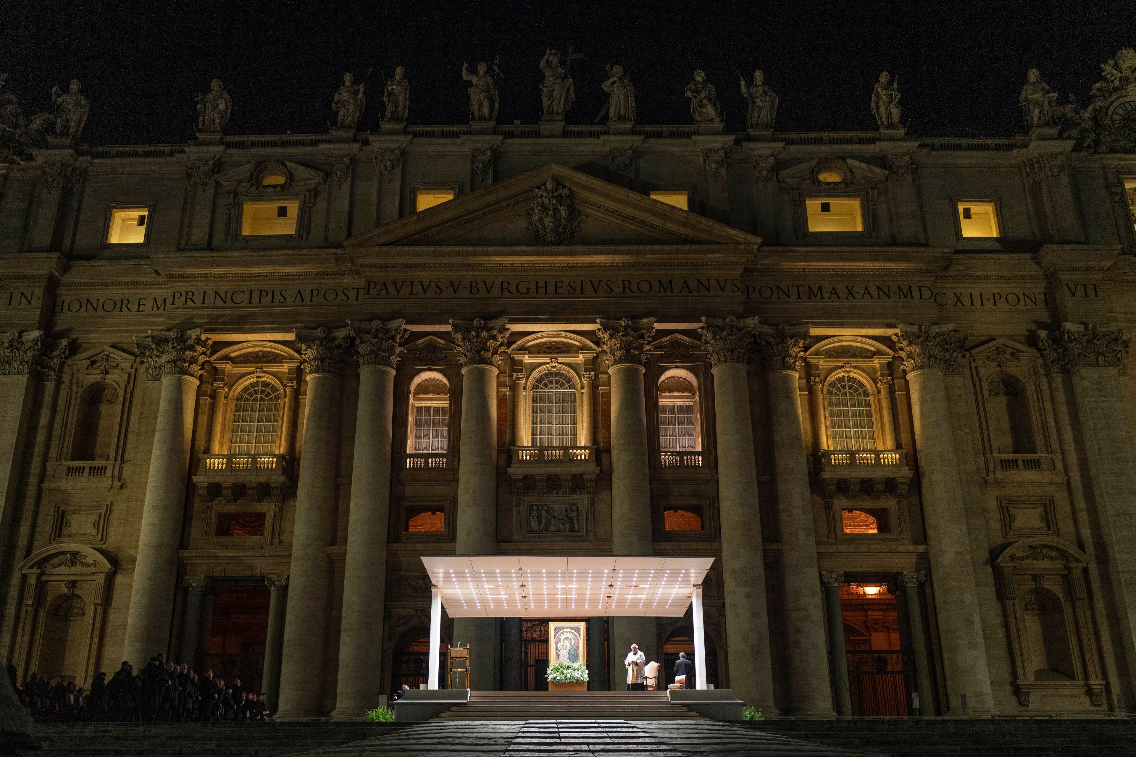 Cardinal Konrad Krajewski, Almsman of His Holiness, leads a nightly rosary prayer for the health of Pope Francis in St. Peter's Square at the Vatican, Sunday, March 2, 2025. (AP Photo/Mosa'ab Elshamy)