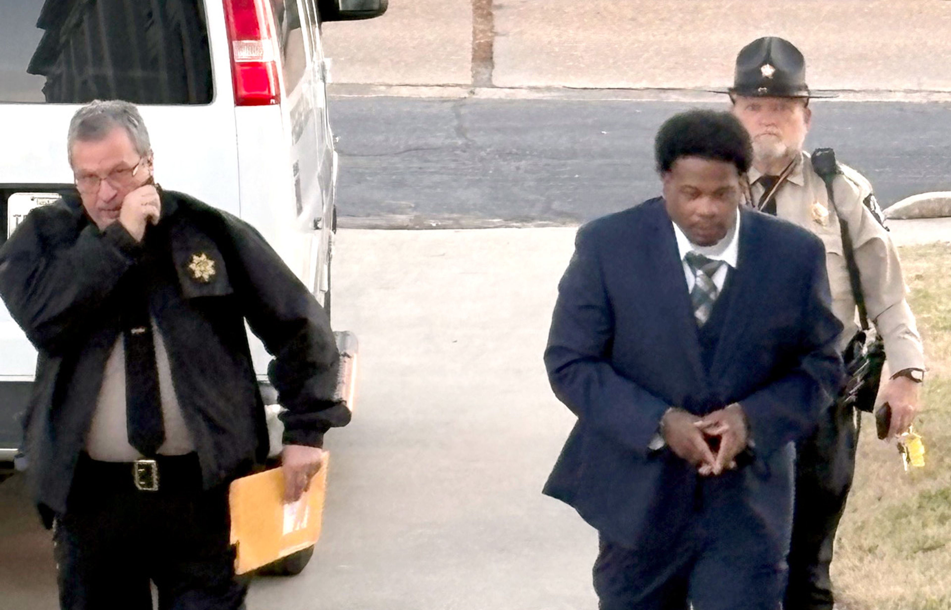 New Madrid County Sheriff deputies Rick Rapert and Robert Phelps escort Cornelius Martel David, a former Charleston resident who resides in Georgia, into the New Madrid County Court  House on Monday, Jan. 5. Following two days of testimony, a jury found David guilty of the Jan. 22, 2023, murder of a Sikeston couple.