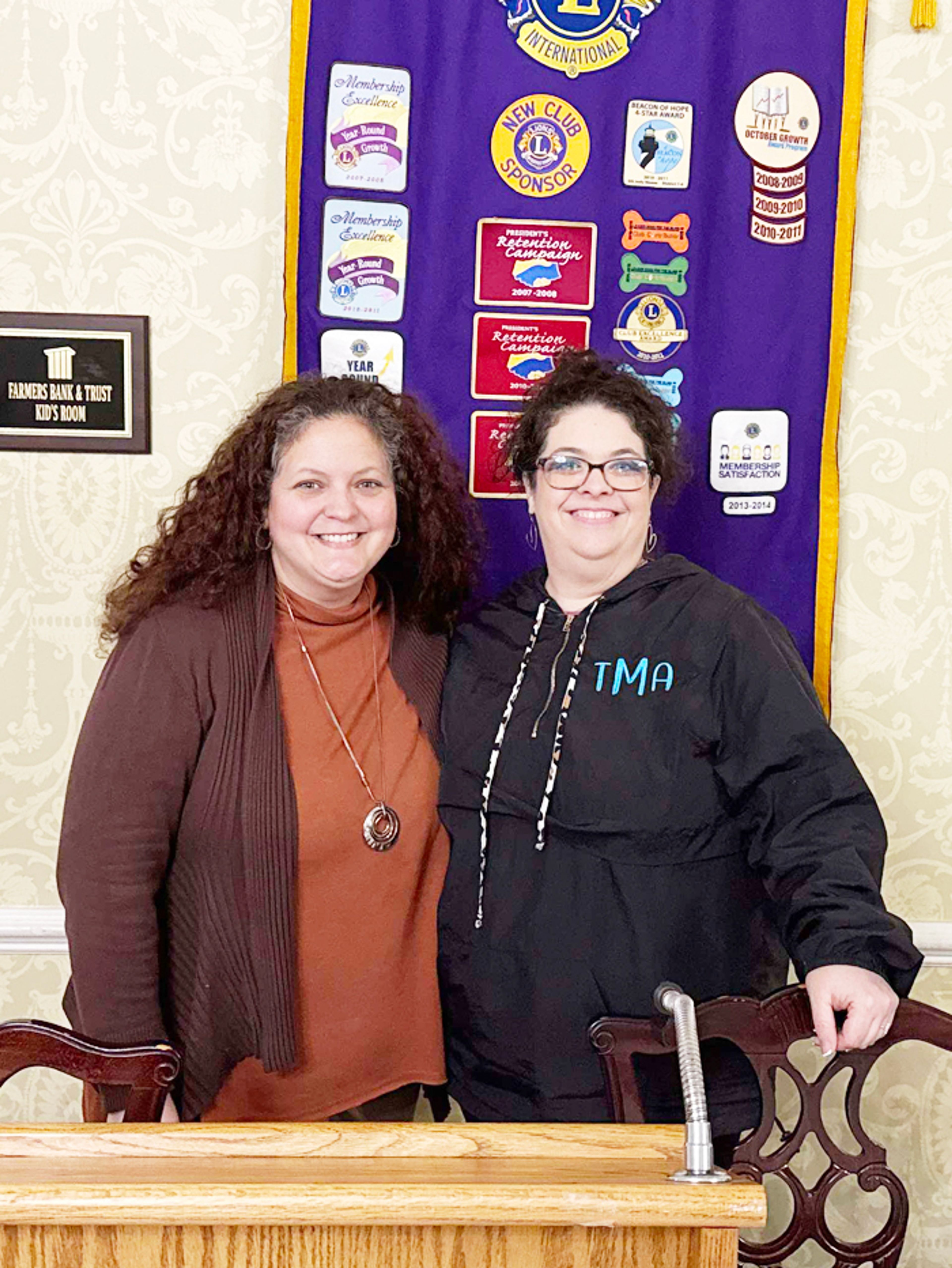 Arkansas Northeastern College Director of Off-Campus Centers Ammi Tucker poses with Lion Tobye McClanahan after Tuesday’s program where Tucker discussed the Wilson Home in Wilson.