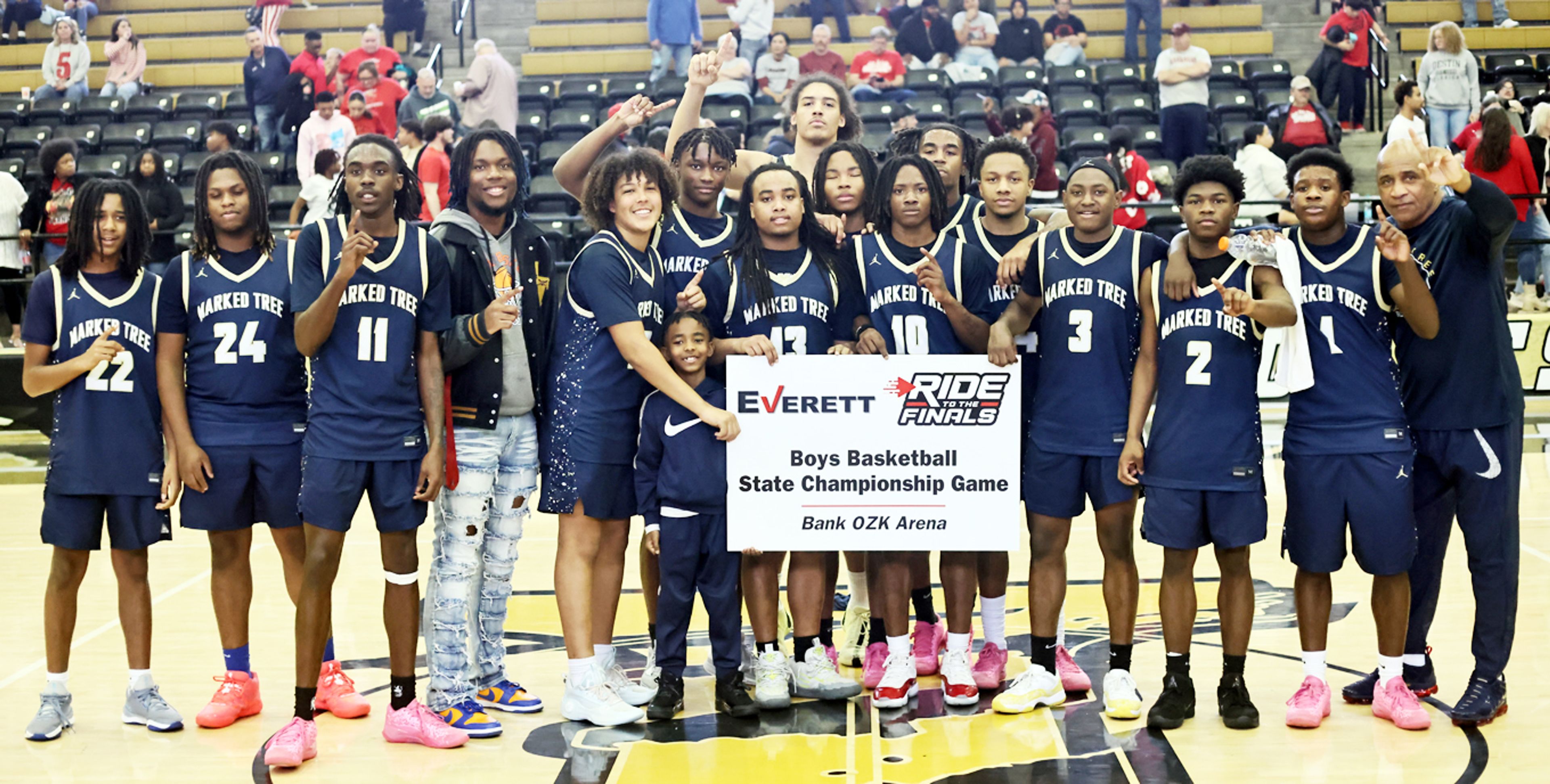 The Marked Tree Indians celebrate with their ticket the Class 2A state finals Saturday in Trumann. (Photo by Cosmo Cossey)