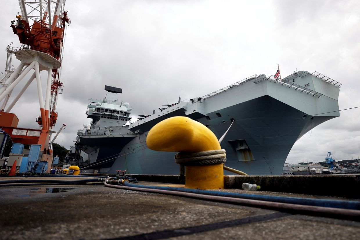 Britain shows off Queen Elizabeth aircraft carrier to anxiou...