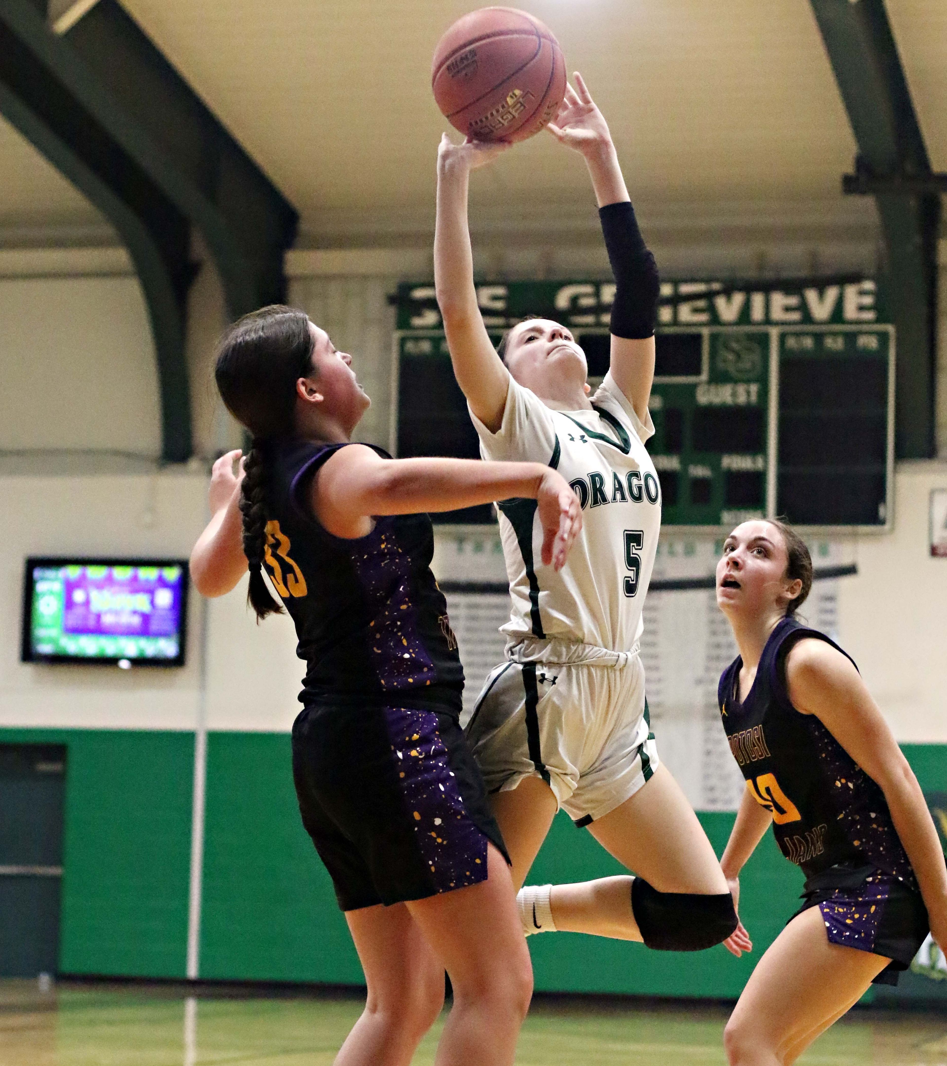 Ste. Genevieve sophomore guard Taylor Beckham (5) gets off a shot against Potosi defenders during high school girls' basketball action on Feb. 27, 2026, at SGHS's Johnson Gym in Ste. Genevieve.