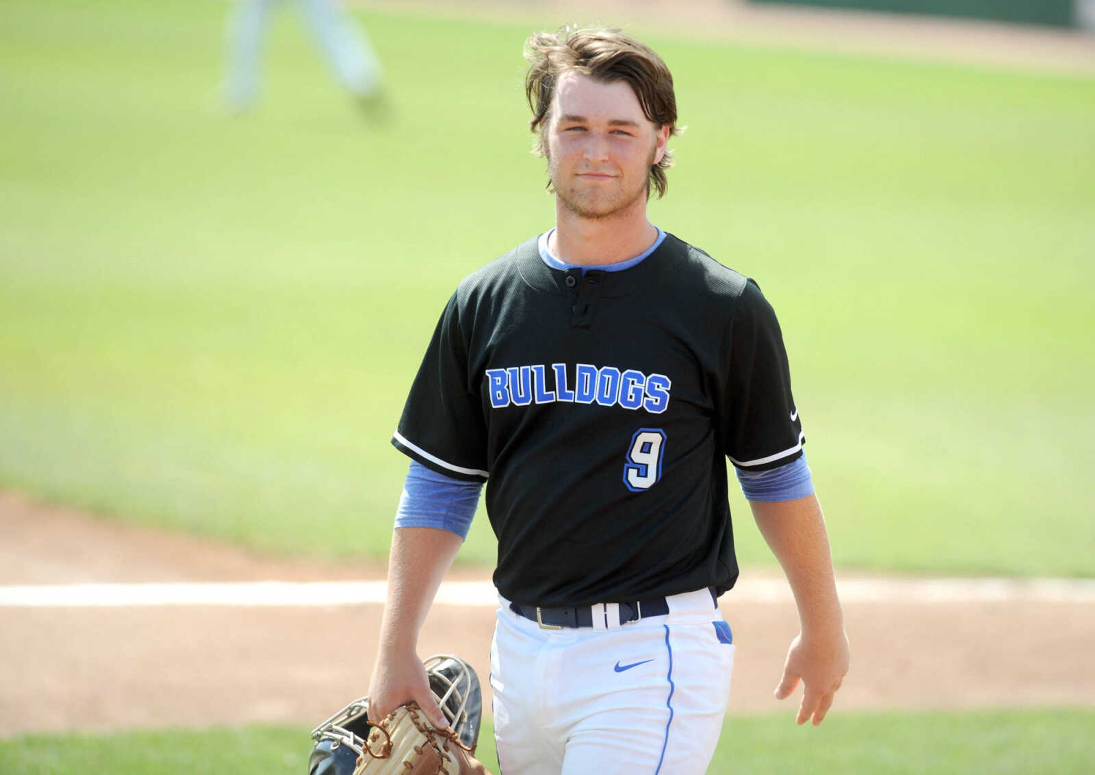 Notre Dame catcher Christian Job heads to the dugout after warming up before the start of the Class 4 semifinal against Smithville, Friday, June 5, 2015, in O'Fallon, Missouri. Notre Dame won 13-3 in six innings. (Laura Simon)