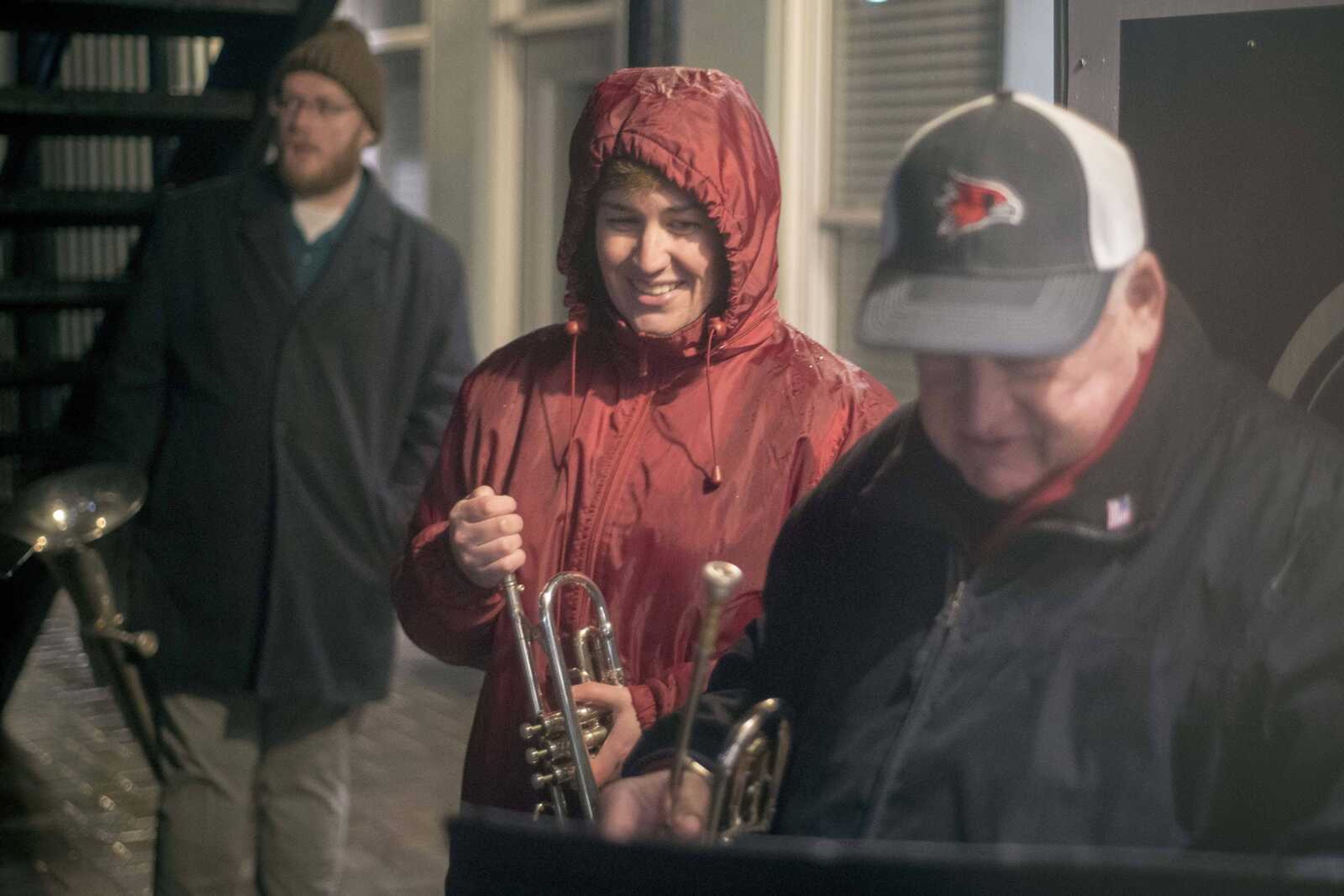 Brooke DeArman, center, prepares to play the trumpet with members of the Jerry Ford Orchestra during the inaugural Christmas tree lighting hosted by Old Town Cape Friday, Nov. 29, 2019, at the Vasterling Suites in Cape Girardeau.