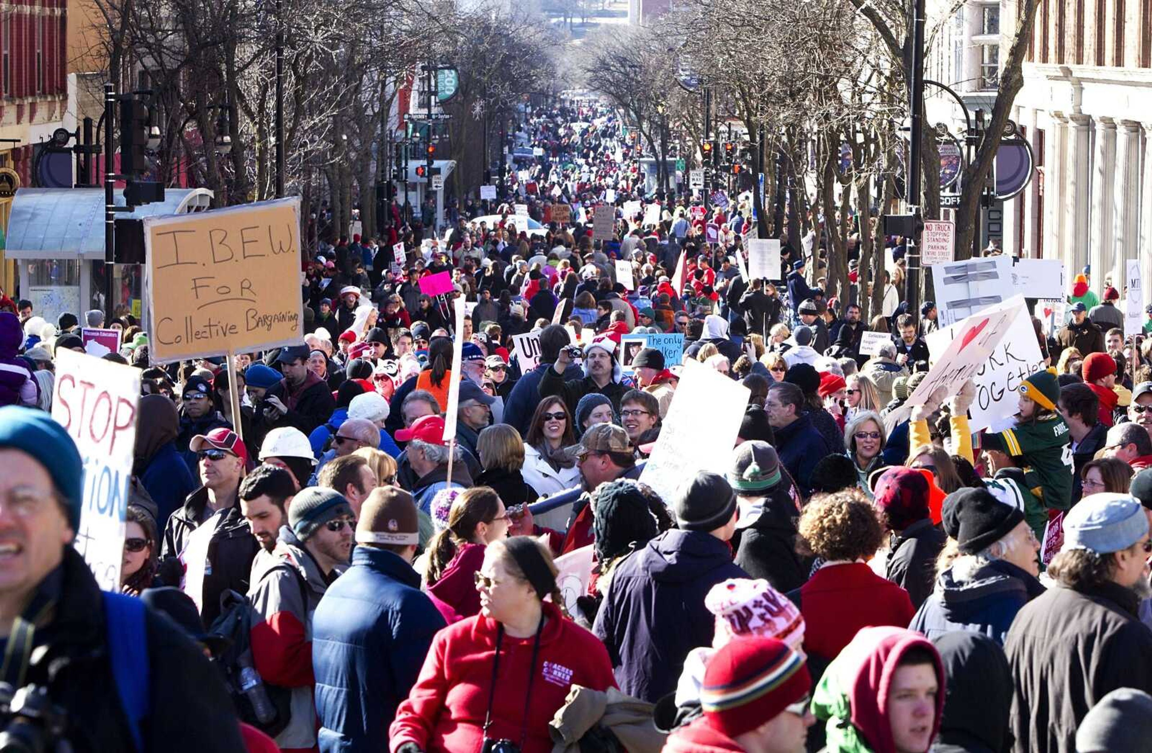 Protesters gather down State Street in Madison, Wis., after a rally Saturday outside the Wisconsin State Capitol. A few dozen police officers stood between supporters of GOP Gov. Scott Walker on the muddy east lawn of the Capitol and the much larger group of pro-labor demonstrators who surrounded them. (Steve Apps ~ Wisconsin State Journal)