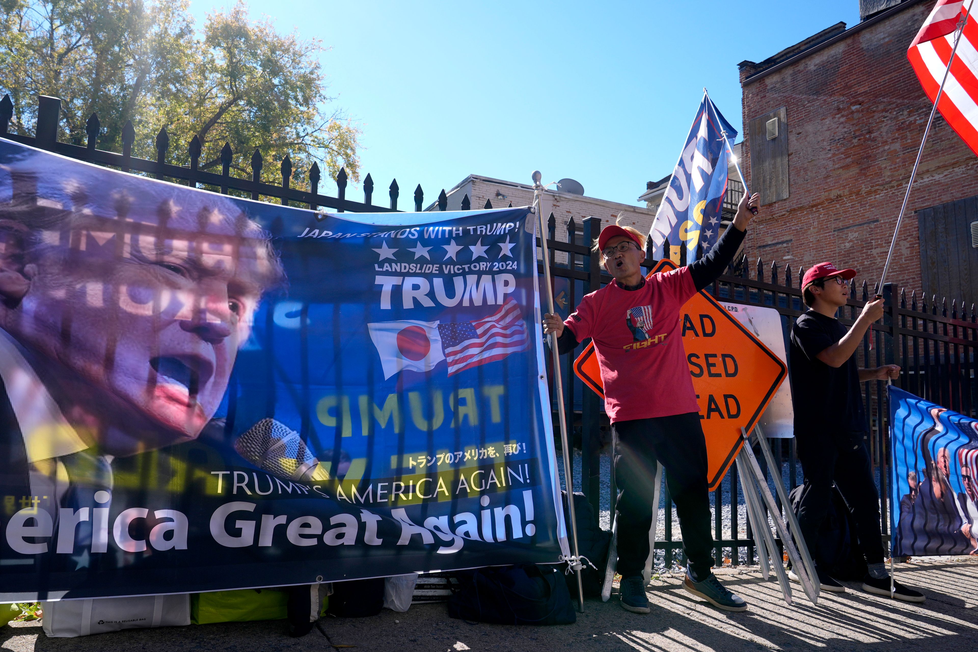 Supporters of Republican presidential nominee former President Donald Trump gather outside the Lancaster Convention Center in Lancaster, Pa., Sunday, Oct. 20, 2024, where Trump will hold a town hall. (AP Photo/Susan Walsh)