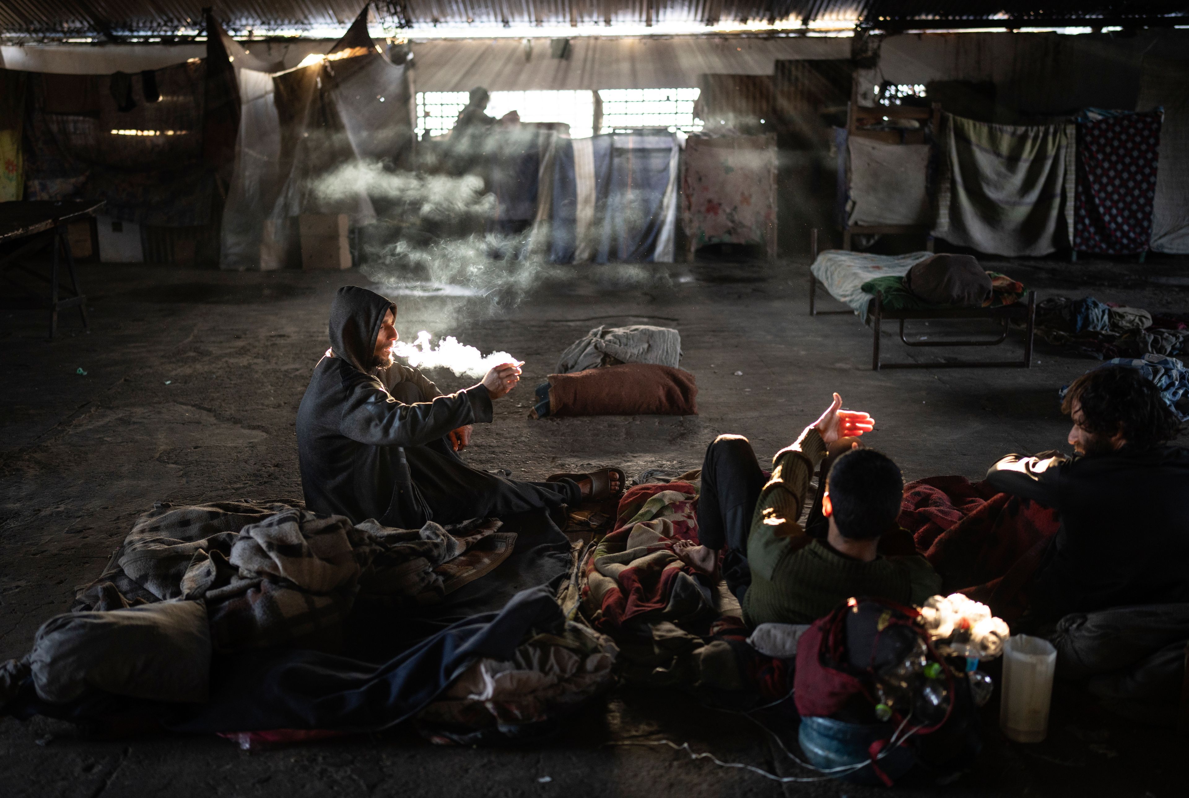 Prisoners smoke crack inside the Tacumbu prison in Asuncion, Paraguay, Sunday, July 8, 2024. Drugs are not allowed but some manage to smuggle them into the jail. (AP Photo/Rodrigo Abd)