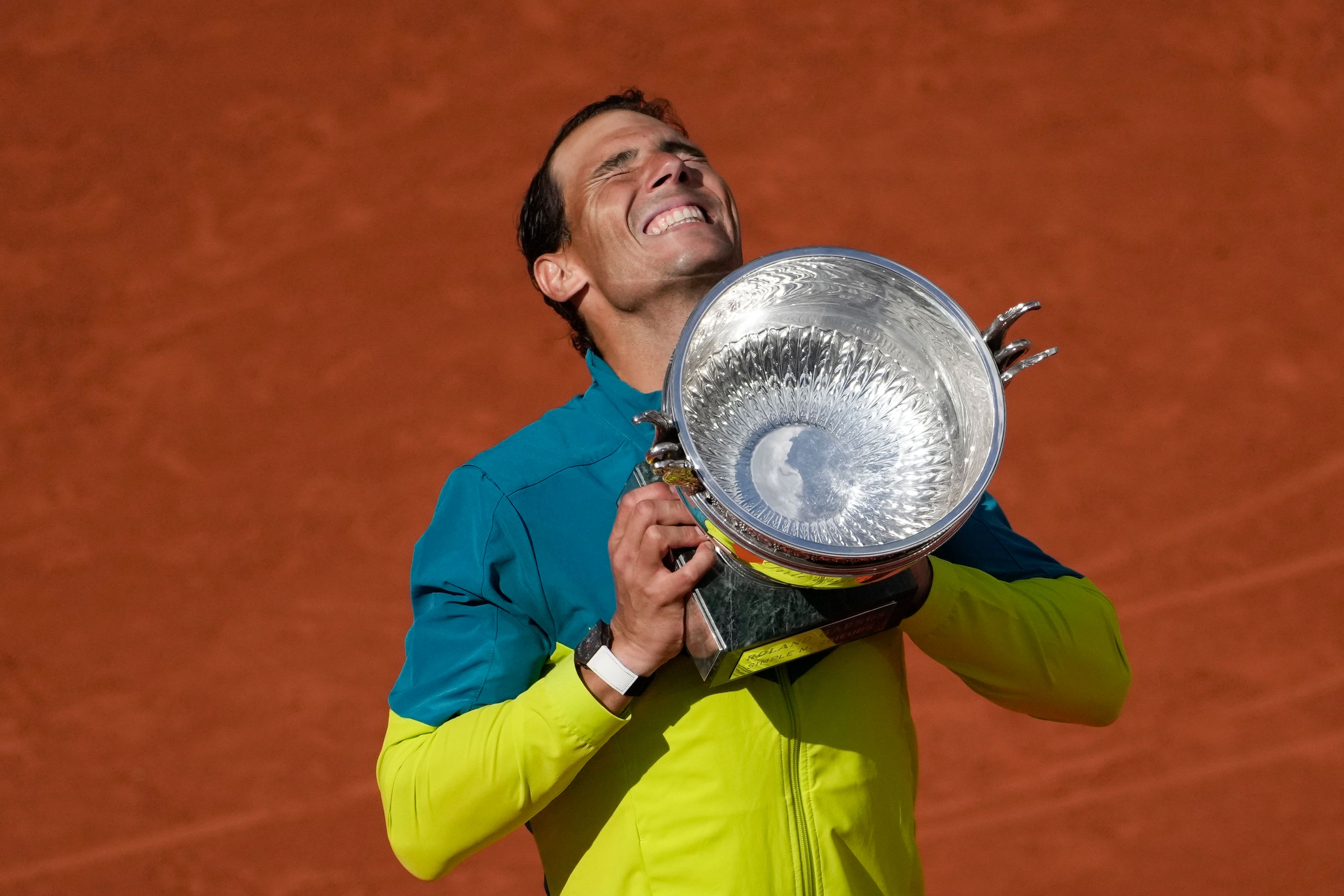 FILE - Spain's Rafael Nadal lifts the trophy after winning the final match against Norway's Casper Ruud in three sets, 6-3, 6-3, 6-0, at the French Open tennis tournament in Roland Garros stadium in Paris, France, Sunday, June 5, 2022, as he has announced he will retire from tennis at age 38 following the Davis Cup finals in November. (. (AP Photo/Christophe Ena, File)