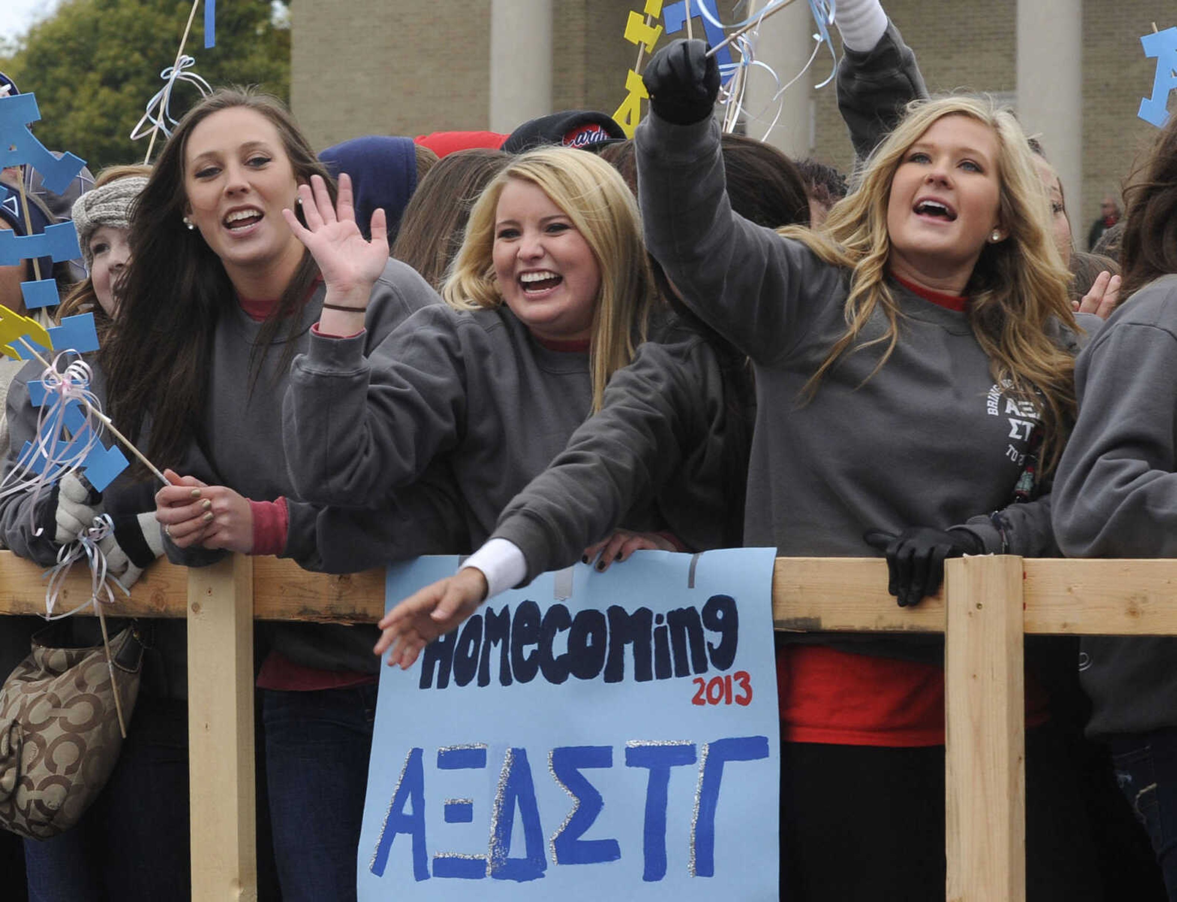 Alpha Xi Delta members ride in the SEMO Homecoming parade Saturday, Oct. 26, 2013 on Broadway in Cape Girardeau.