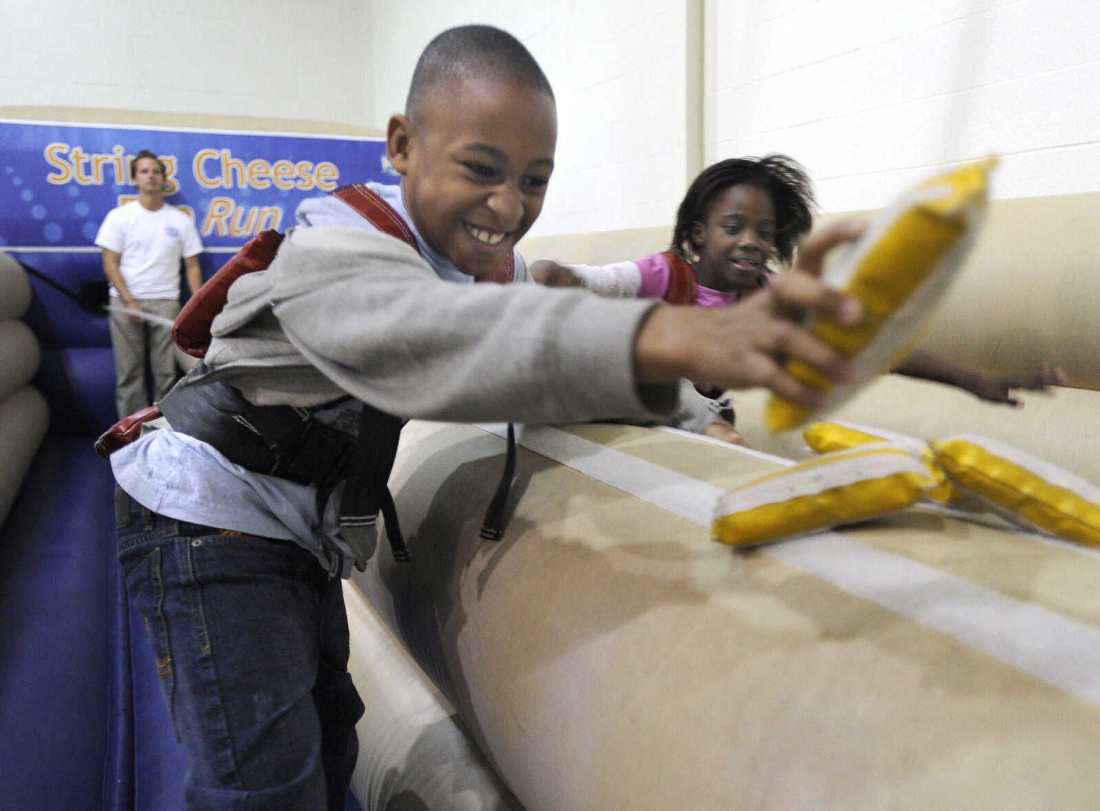 FRED LYNCH ~ flynch@semissourian.com
Caylon Randle, left, races Kwayauna Chisom for the cheese on the Dairy Fully Fueled Tour, Tuesday, Nov. 9, 2010 at Franklin Elementary School.