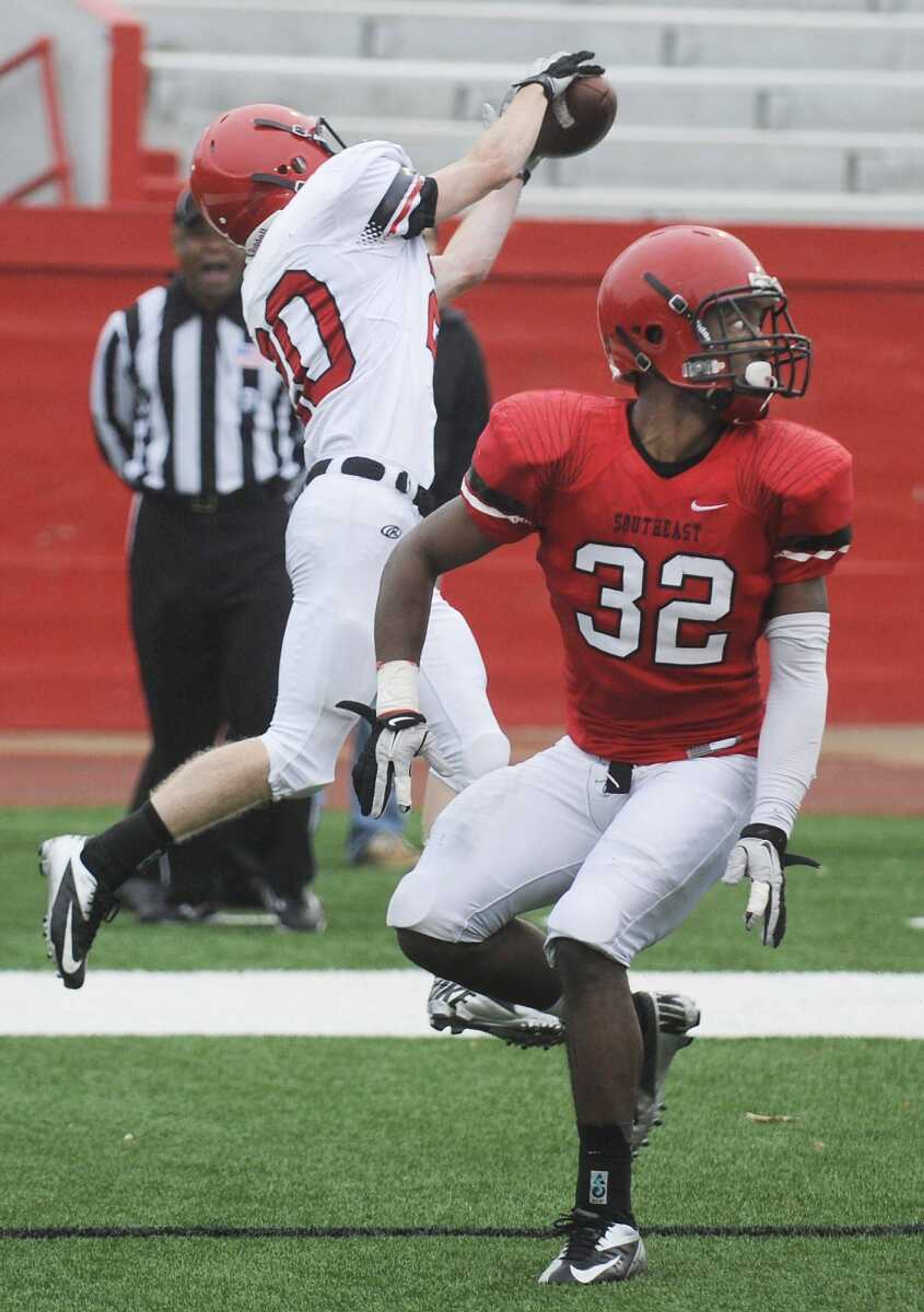 Southeast Missouri State wide receiver Garett Schaefer gets past corner back Reggie Jennings to bring down a touchdown pass from quarterback Kyle Snyder during the offense&#8217;s game winning drive in the fourth quarter of the 2013 Southeast Missouri State Spring Game on Saturday. The offense beat the defense 16-13. (ADAM VOGLER)