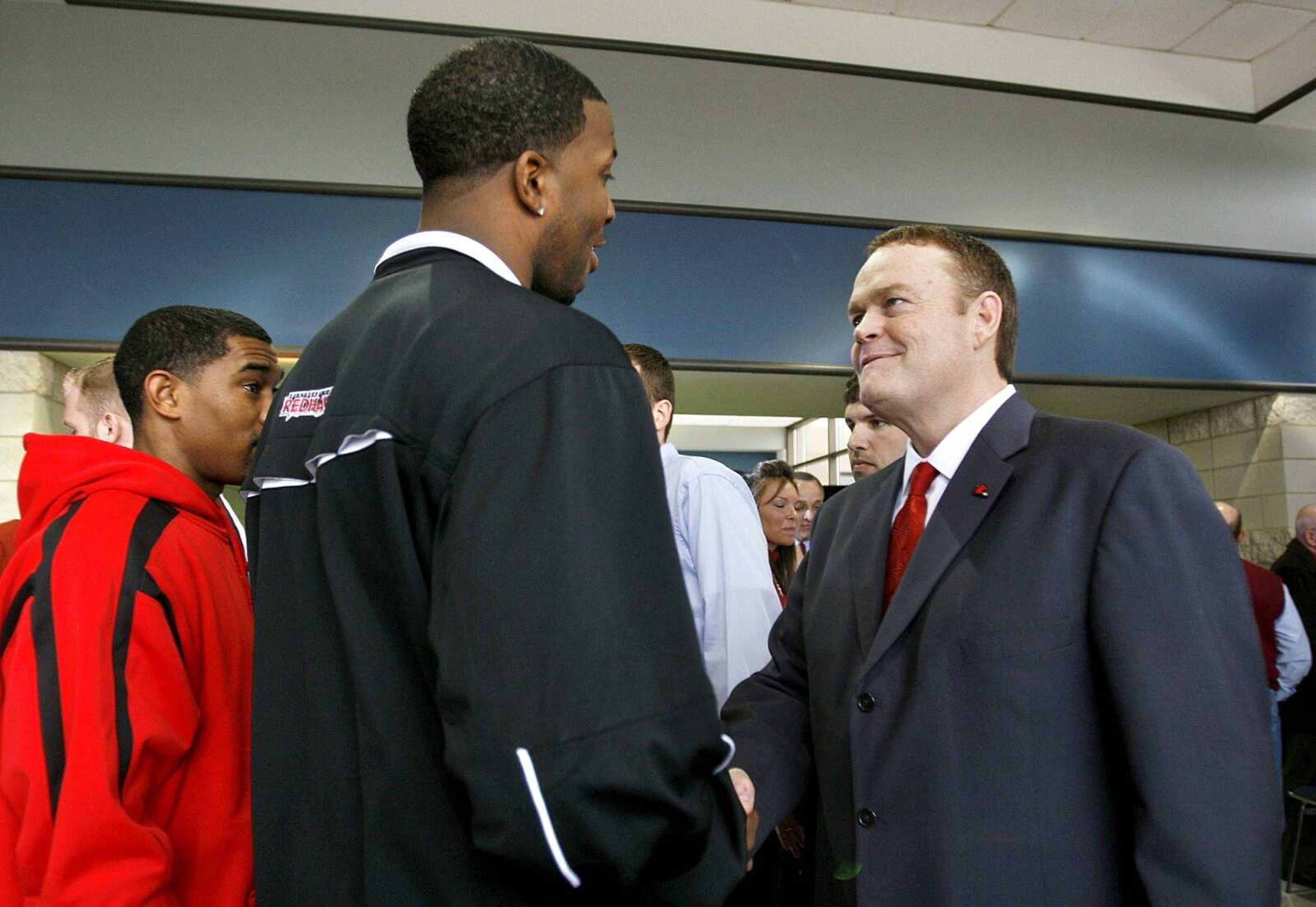 Dickey Nutt, right, meets Israel Kirk at a press conference at the Show Me Center after being named Southeast's men's basketball coach. (Elizabeth Dodd ~ Southeast Missourian archive)