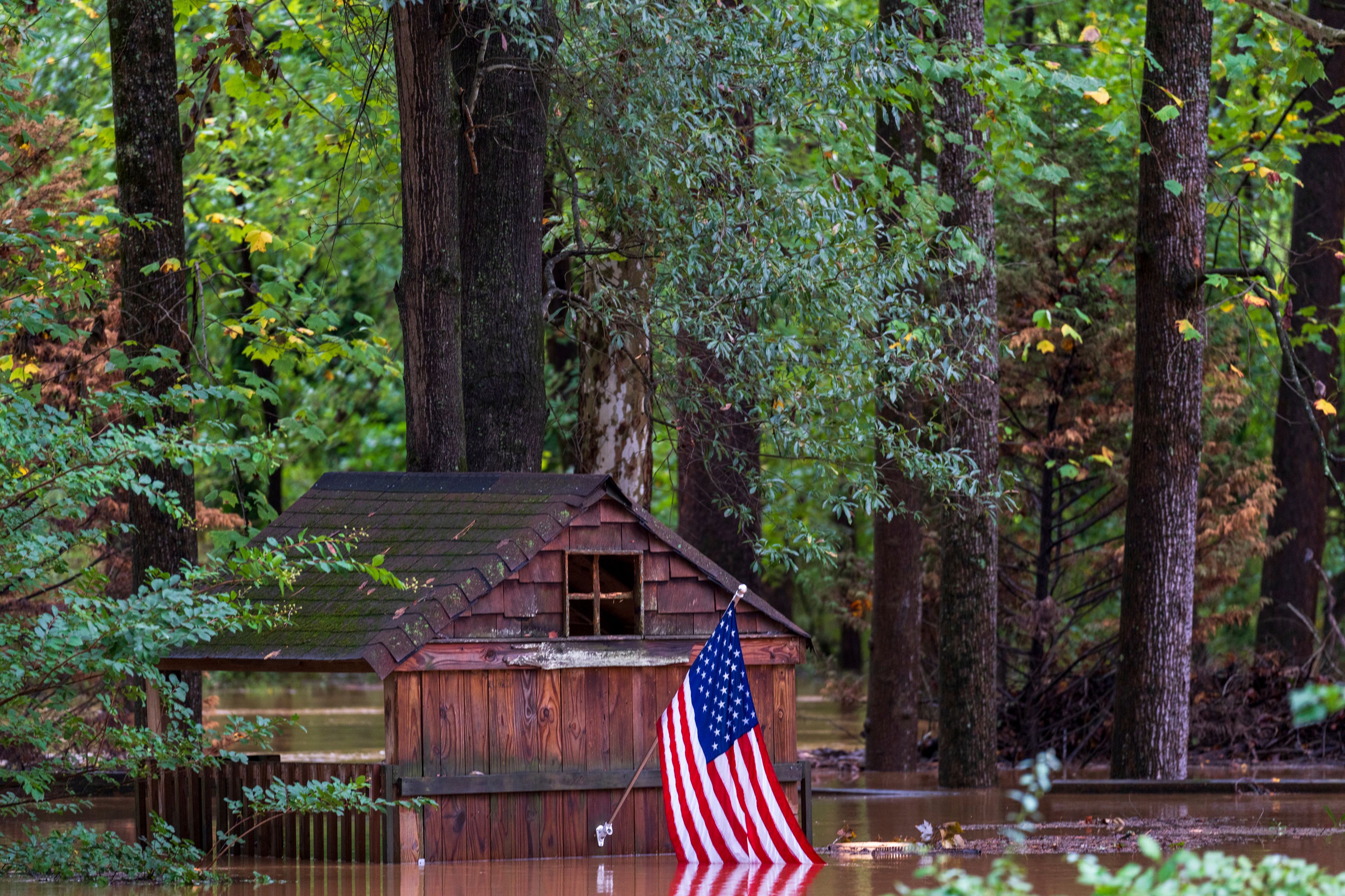 Floodwaters surround a structure Friday, Sept 27, 2024, in Atlanta. (AP Photo/Jason Allen)