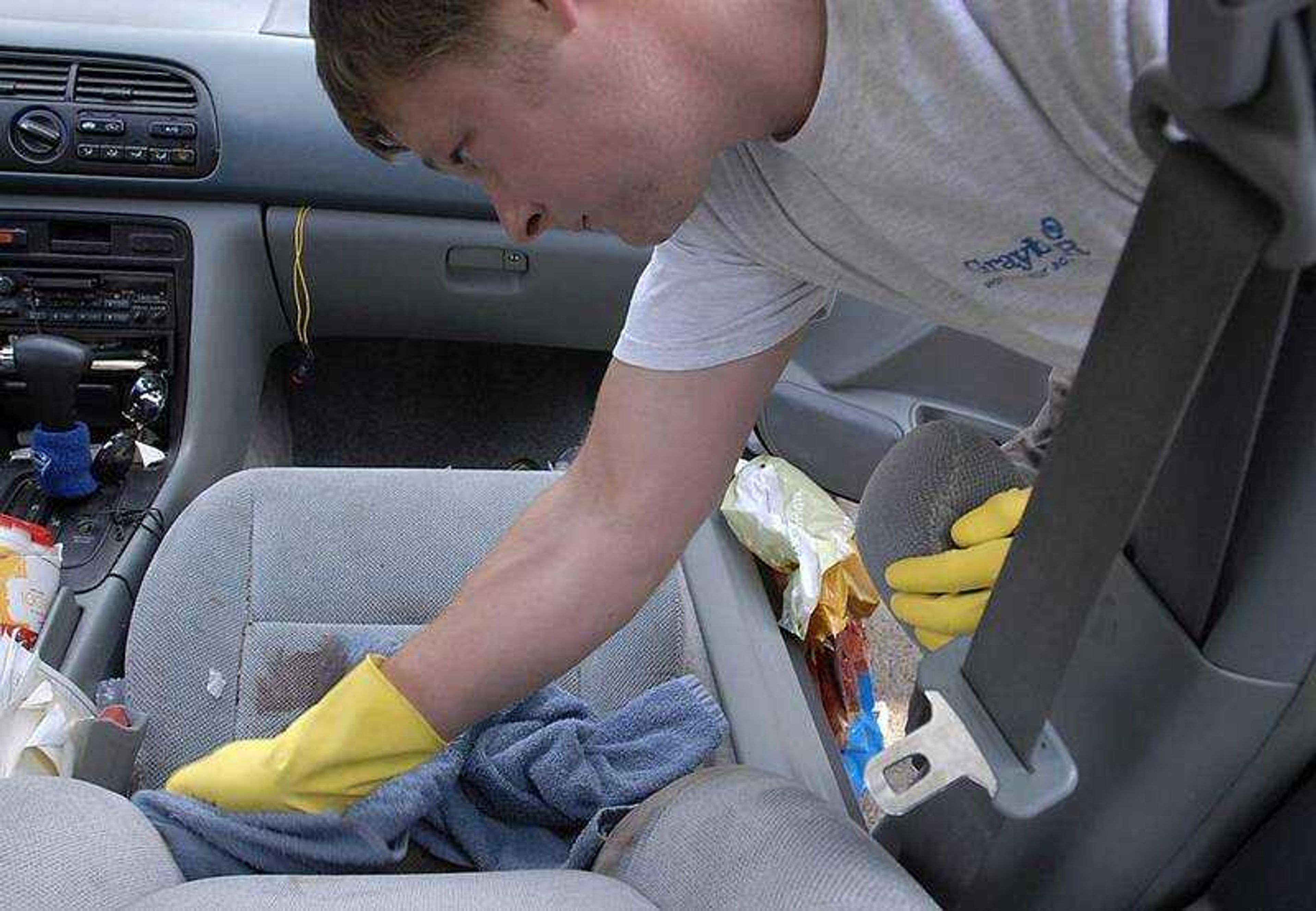 KIT DOYLE ~ kdoyle@semissourian.com
Blake Pope cleaned blood from the passenger seat of his car after taking a shooting victim to the hospital Wednesday from near Pope's home in the 600 block of Louis Street in south Cape Girardeau.