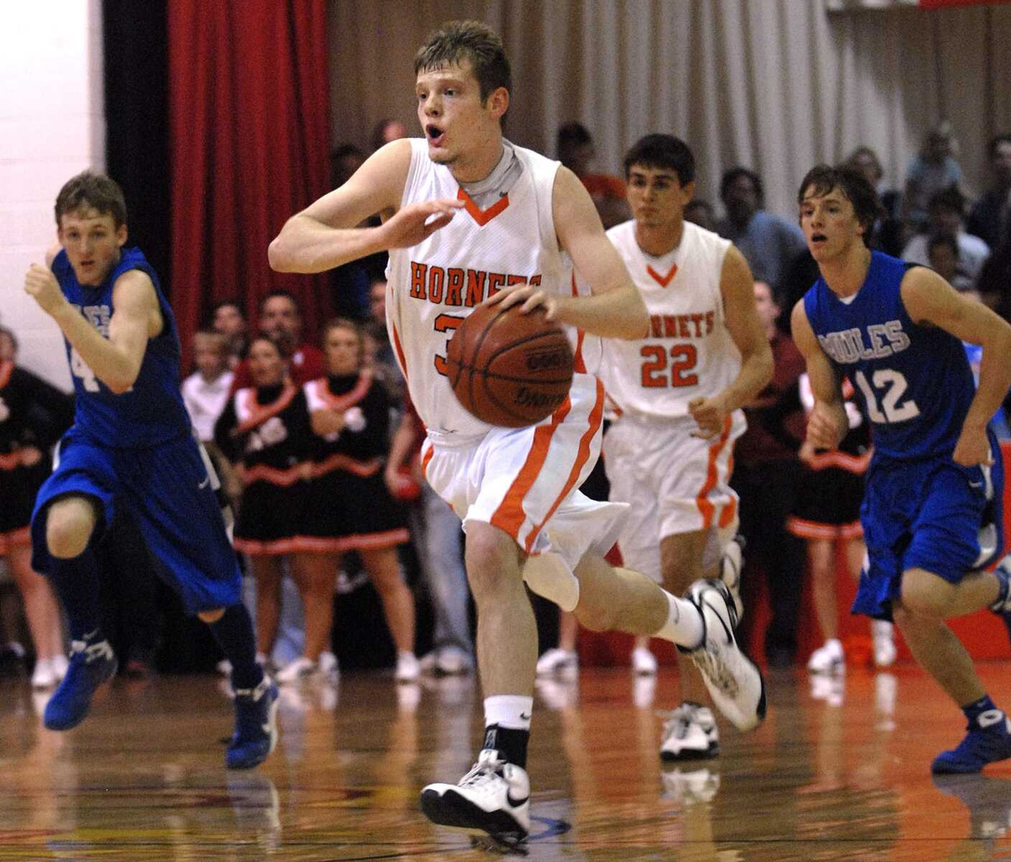 FRED LYNCH ~ flynch@semissourian.com
Advance's Jacob Bond drives on a fast break against Bernie during the second quarter in the Class 2 District 3 championship game Thursday at Chaffee.