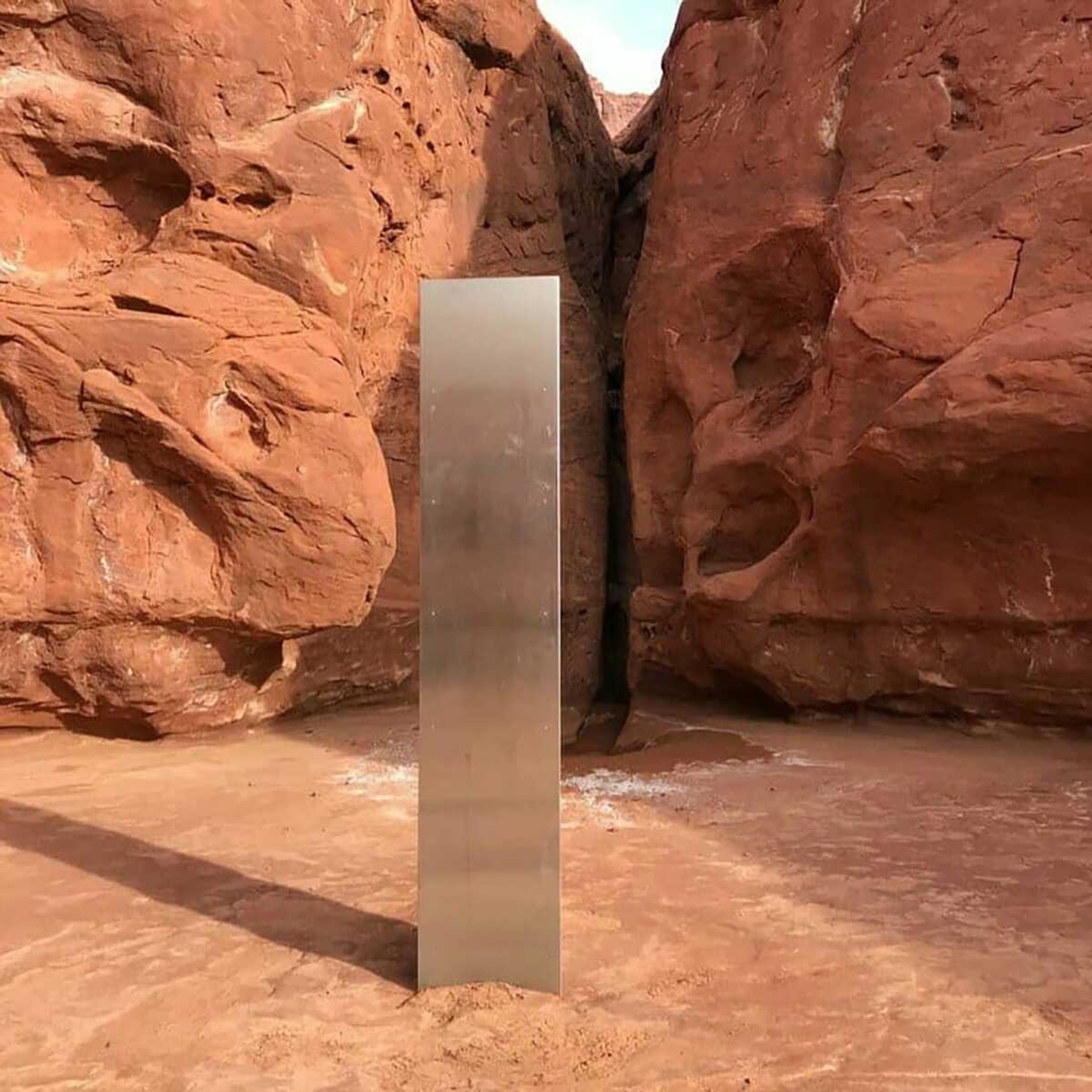 A metal monolith is seen in the ground Nov. 18 in a remote area of red rock in Utah.