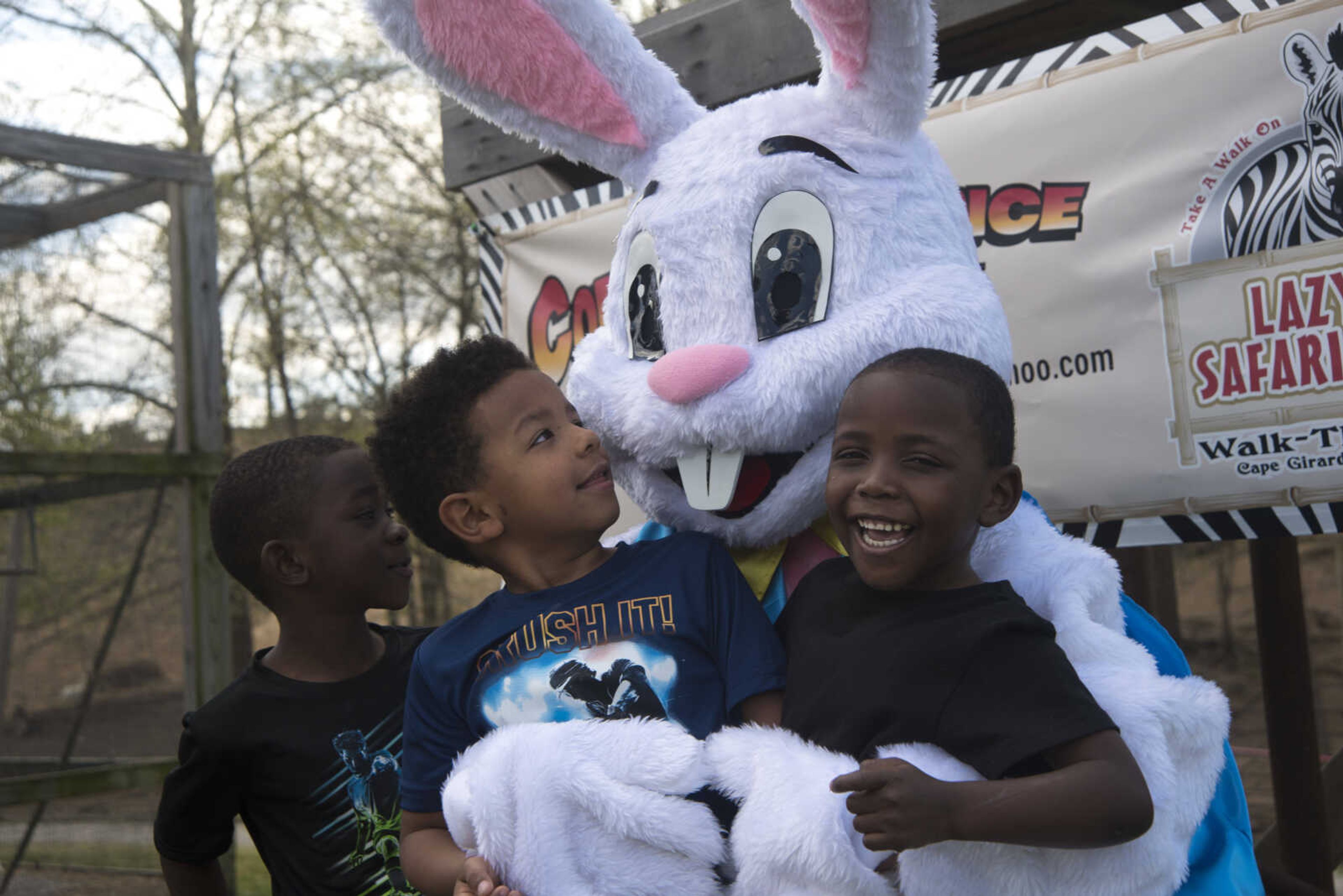 From left, Kameron Redman, 5, Kyron Redd, 5, and RJ Fountain, 4, pose with the Easter bunny during the Safari Egg Hunt Saturday, April 15, 2017 at Lazy L Safari Park in Cape Girardeau.