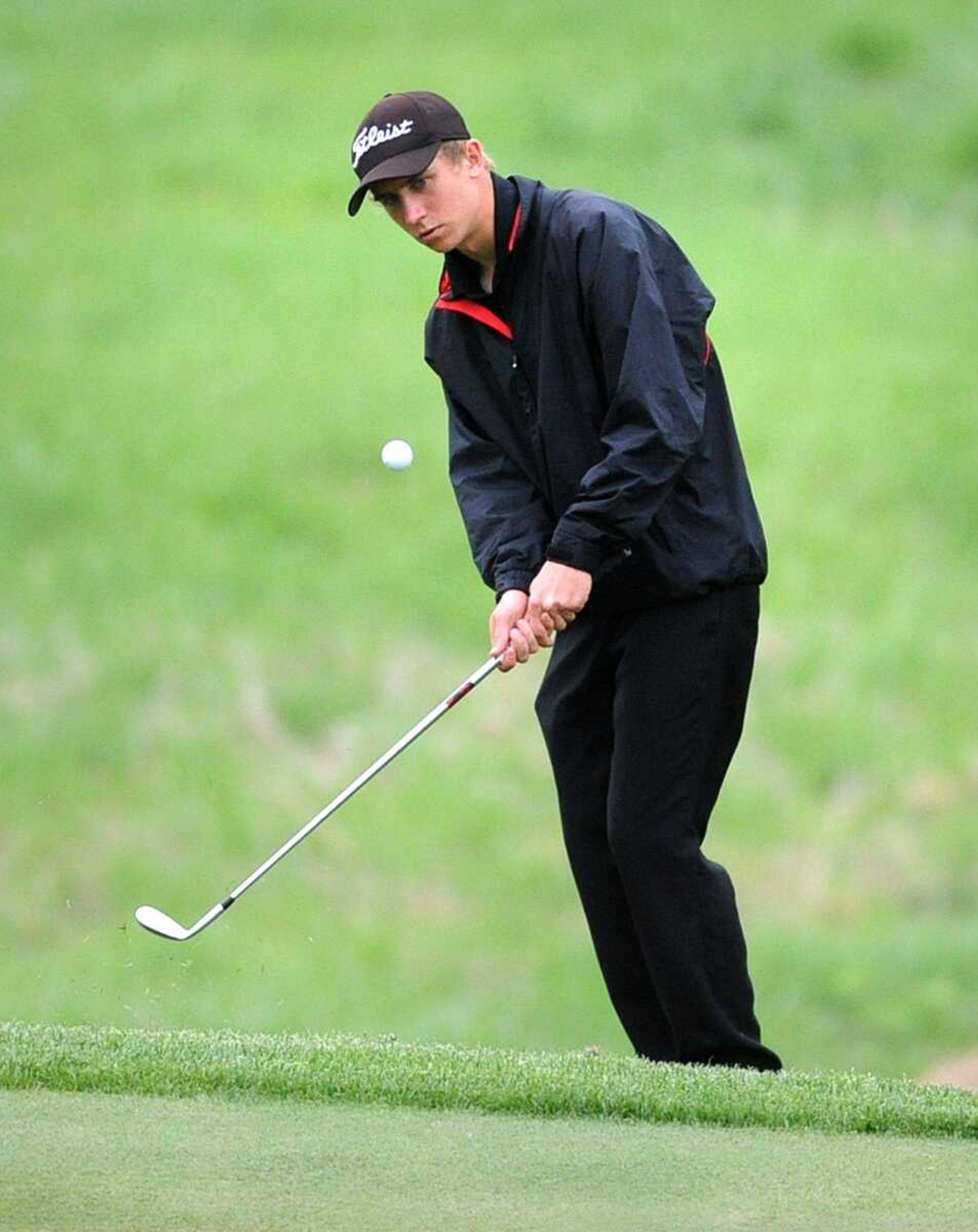 Central&#8217;s Travis Simmons watches his chip onto the fifth green Tuesday during the SEMO Conference Tournament at Dalhousie Golf Club. Simmons was medalist with a 2-over 74. (Laura Simon)