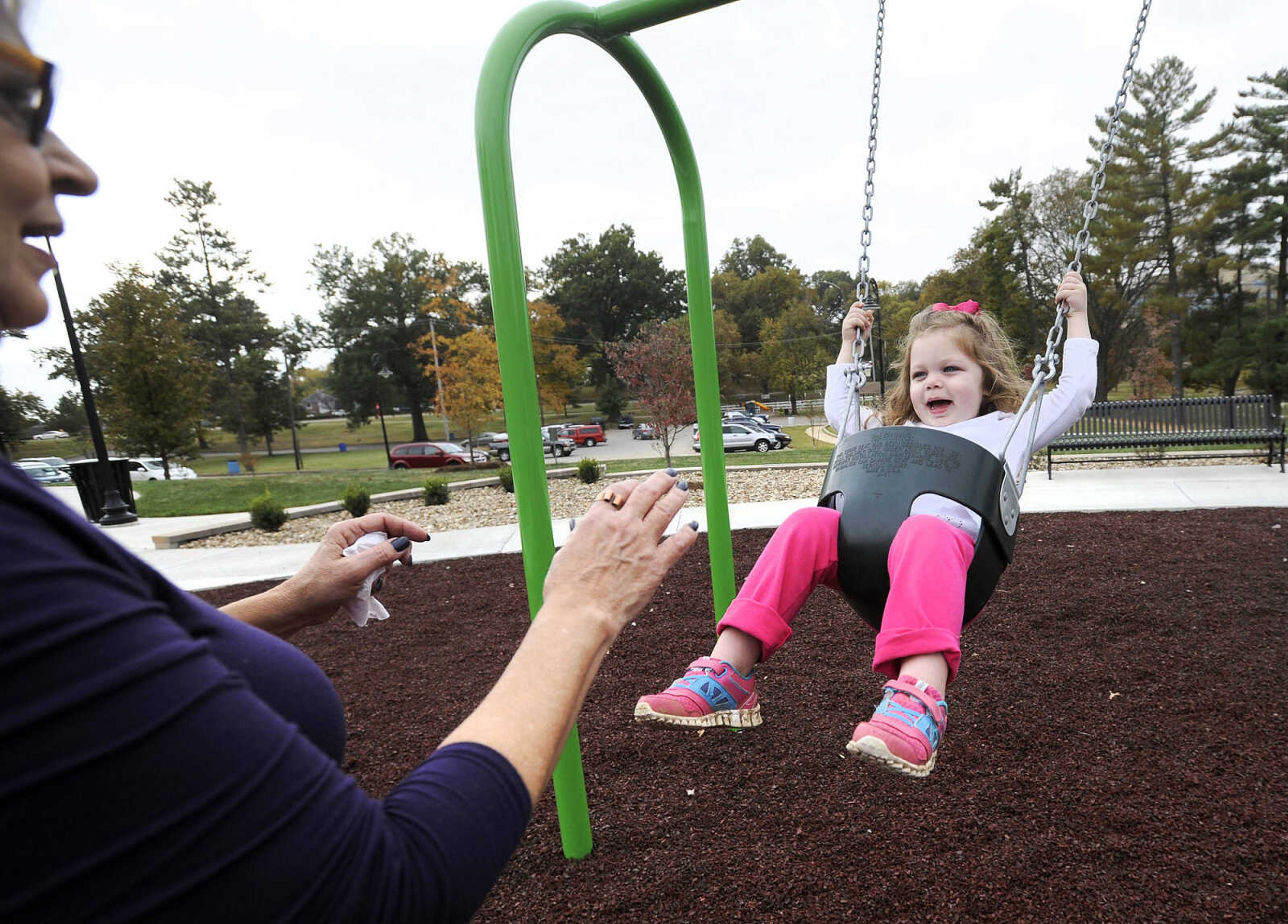 LAURA SIMON ~ lsimon@semissourian.com

Marsha Williamson pushes her granddaughter, Nora Bullock on the swings at the new playground at Capaha Park, Friday, Oct. 23, 2015, in Cape Girardeau.