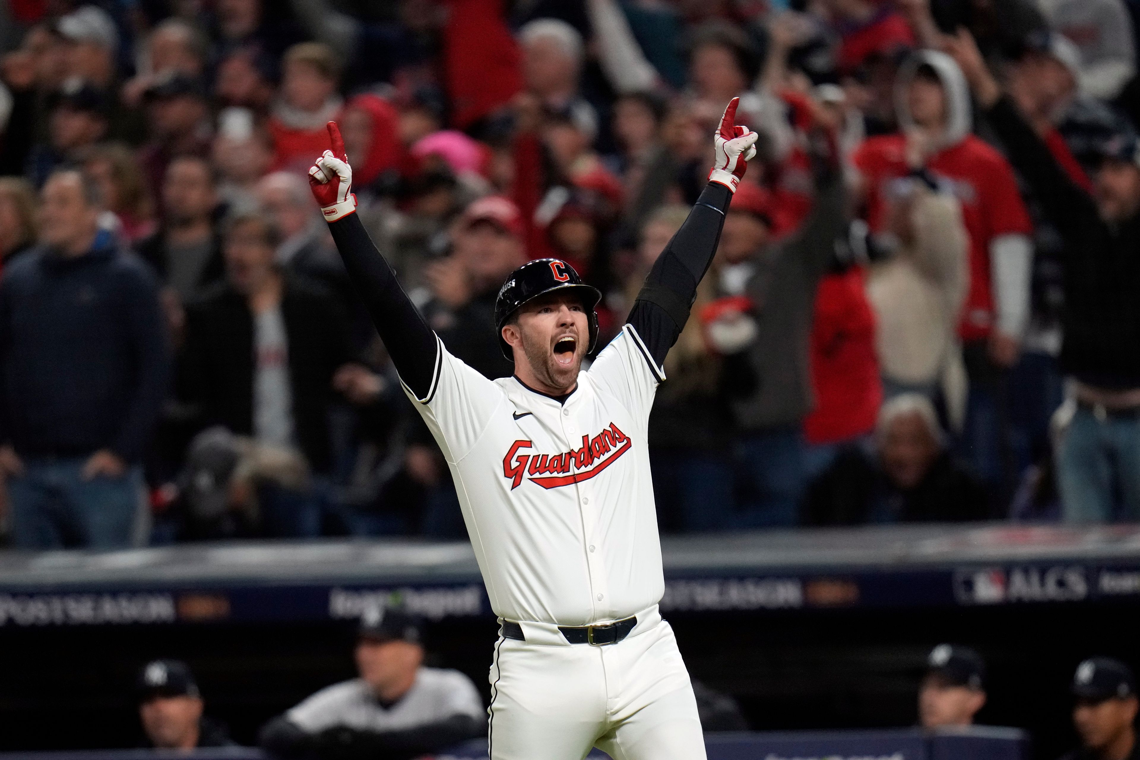 Cleveland Guardians' David Fry celebrates after hitting a game-winning two-run home run against the New York Yankees during the 10th inning in Game 3 of the baseball AL Championship Series Thursday, Oct. 17, 2024, in Cleveland. The Guardians won 7-5. (AP Photo/Jeff Roberson)