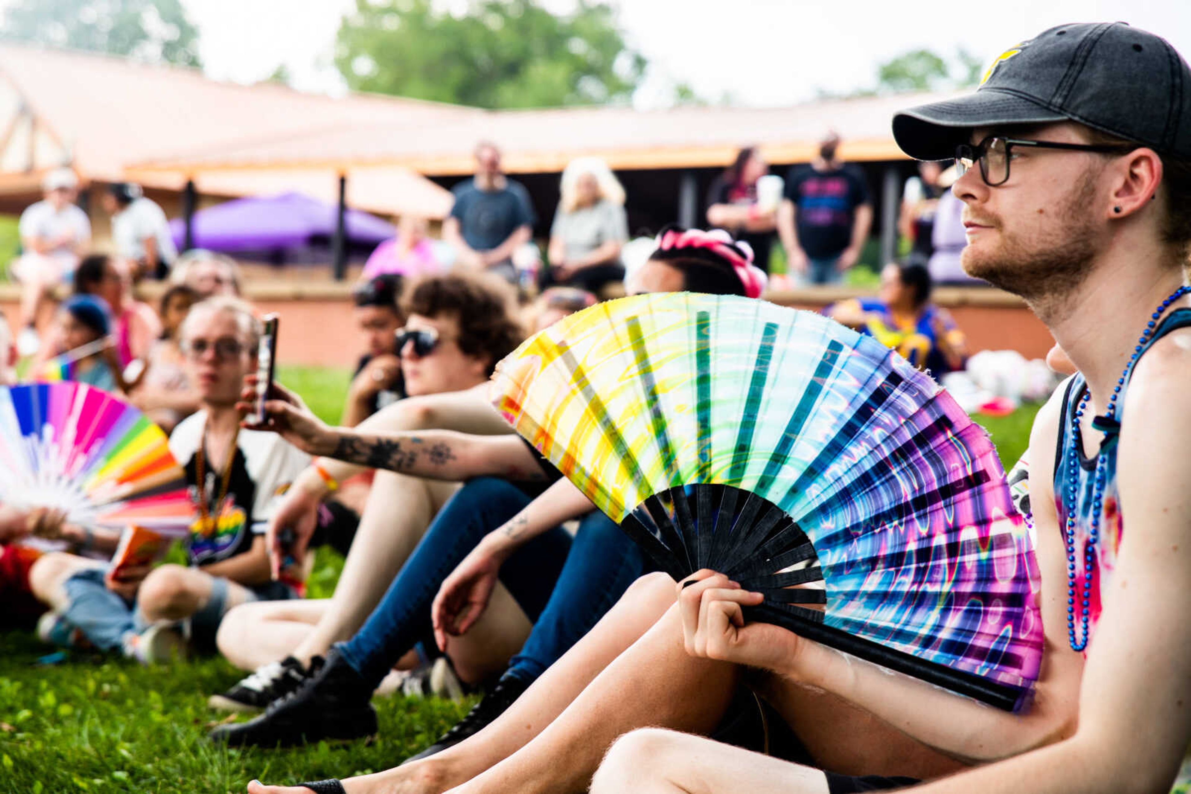 Shane Wright holds a rainbow fan at the annual Pride in the Park celebration on Sunday, June 4 at Capaha Park.