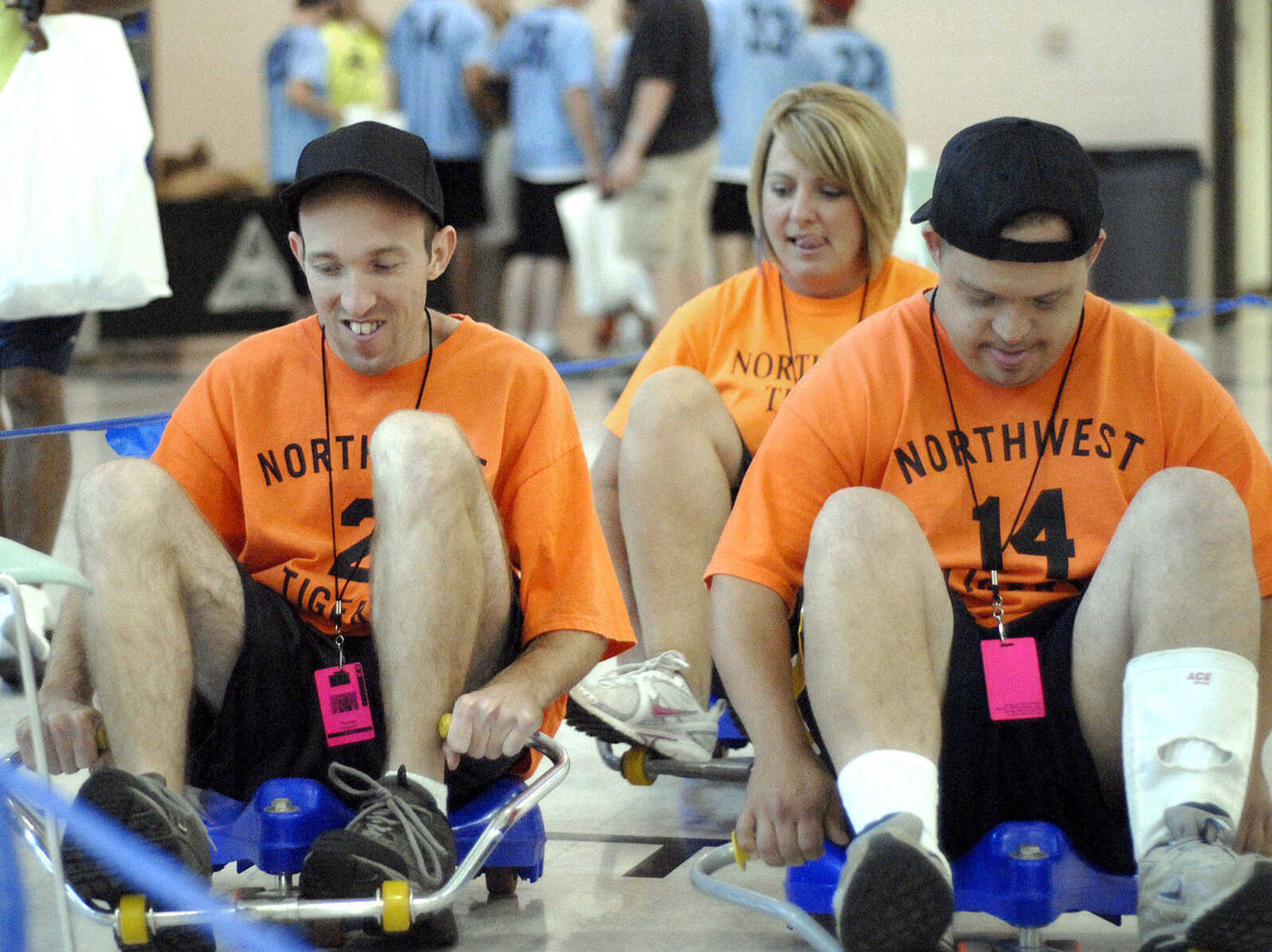 LAURA SIMON ~ lsimon@semissourian.com
Coach Kelly Smith, center, tries to catch up with members of her team Thomas Fergison, left, and Tanner Hrenchir on the roller scooters at Victory Village inside the the Osage Centre Saturday, August 13, 2011 in Cape Girardeau.