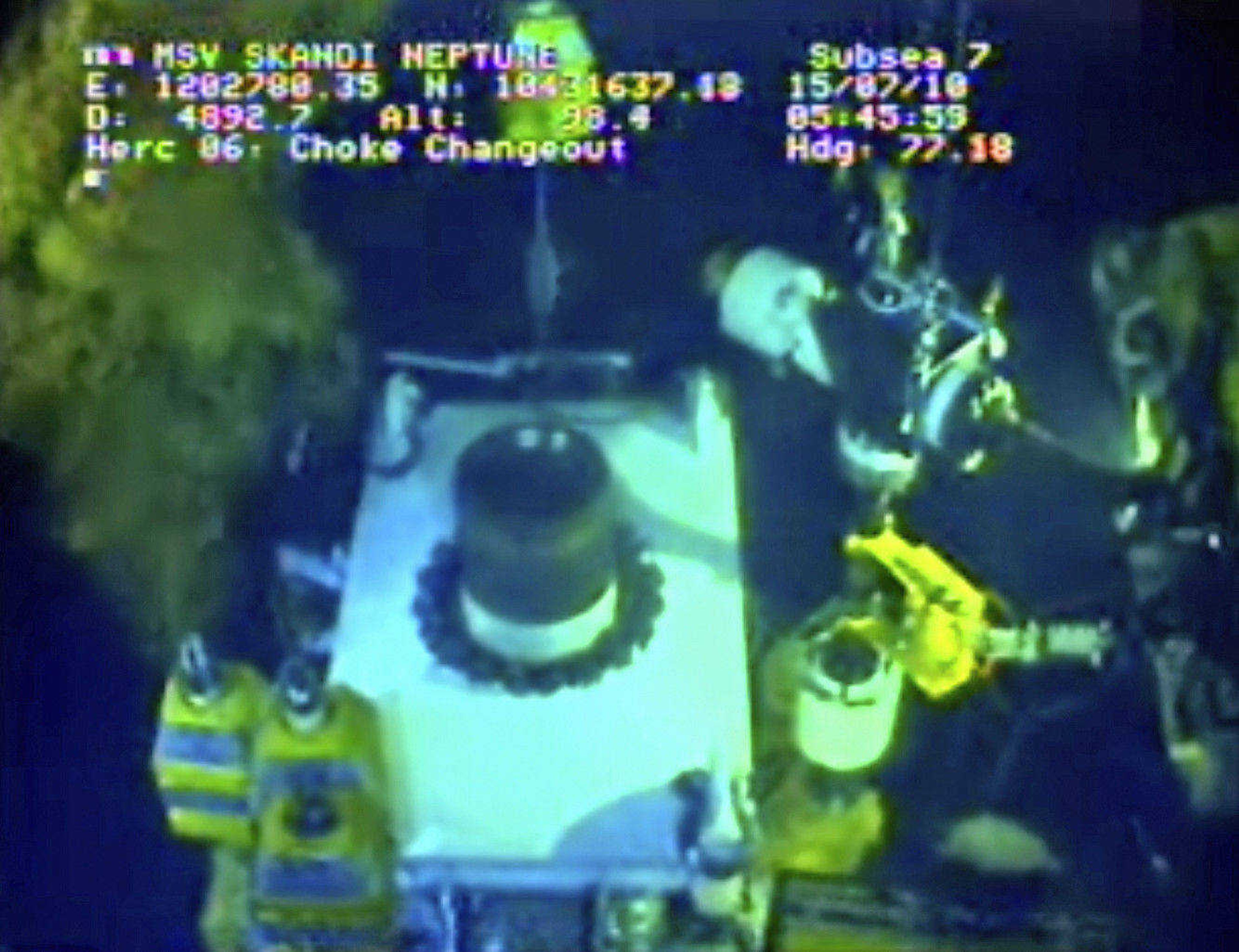 In this image taken from video provided by BP PLC at 6:45 a.m. EDT Thursday July 15, 2010, oil flows from one of three valves of the new 75-ton cap atop the site of the Deepwater Horizon oil spill in the Gulf of Mexico as testing continues Thursday. BP engineers said later Thursday they were able to stop the oil flowing into the Gulf for the first time since April. (AP Photo/BP PLC) NO SALES