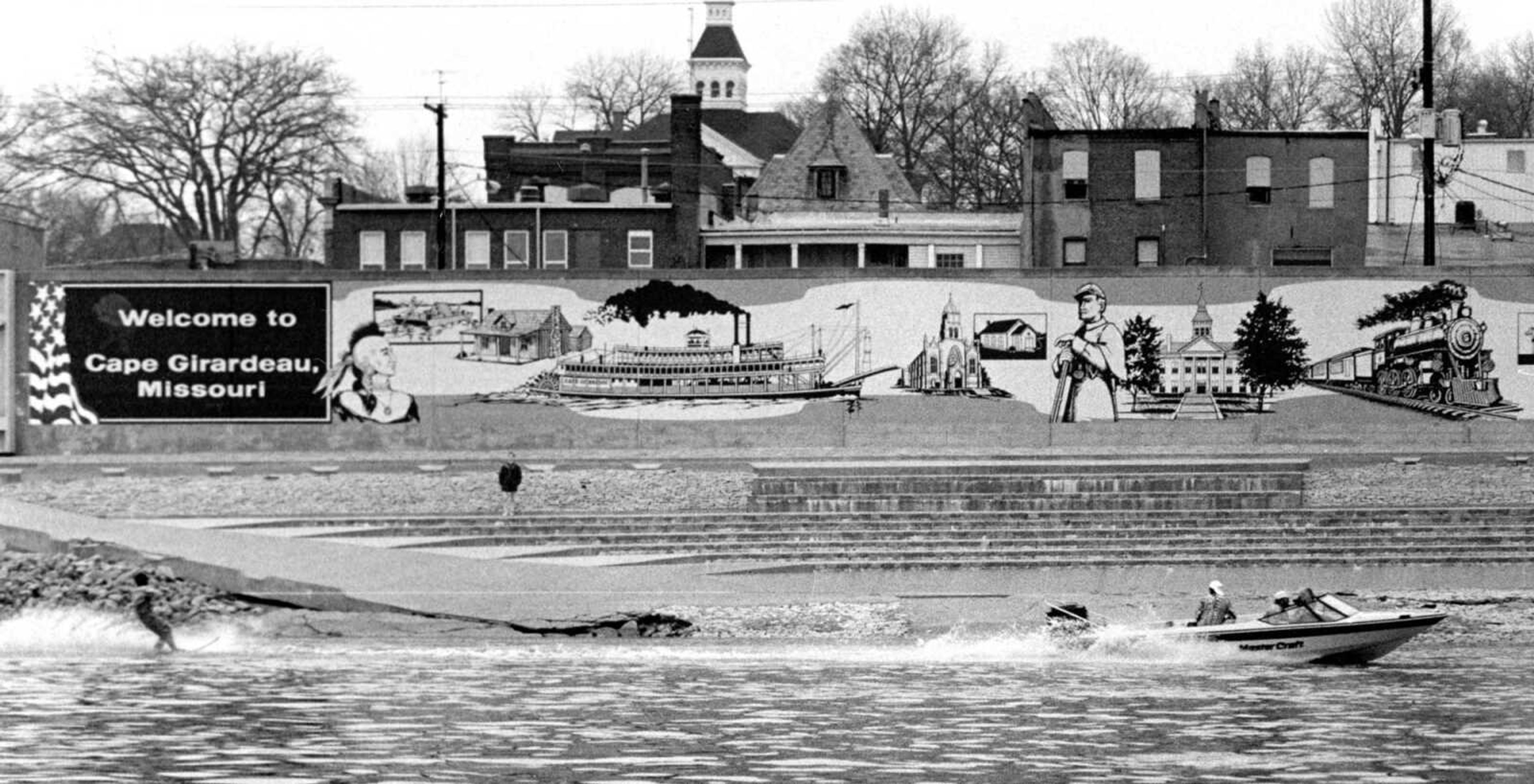 Published Jan. 2, 1992.
Mike Kassel of Cape Girardeau skied past the Cape Girardeau riverfront during a New Year's Day fund-raising event. Kassel and Jeff Teaters, also of Cape Girardeau, held the "Ski Freeze" to raise funds for Terry Frayser of Cape Girardeau. Members of the Honkers Boat Club skied New Year's Day for several years to raise money for various charities. They missed doing so in 1991, because of ice on the river. (Mark Sterkel ~ Southeast Missourian archive)