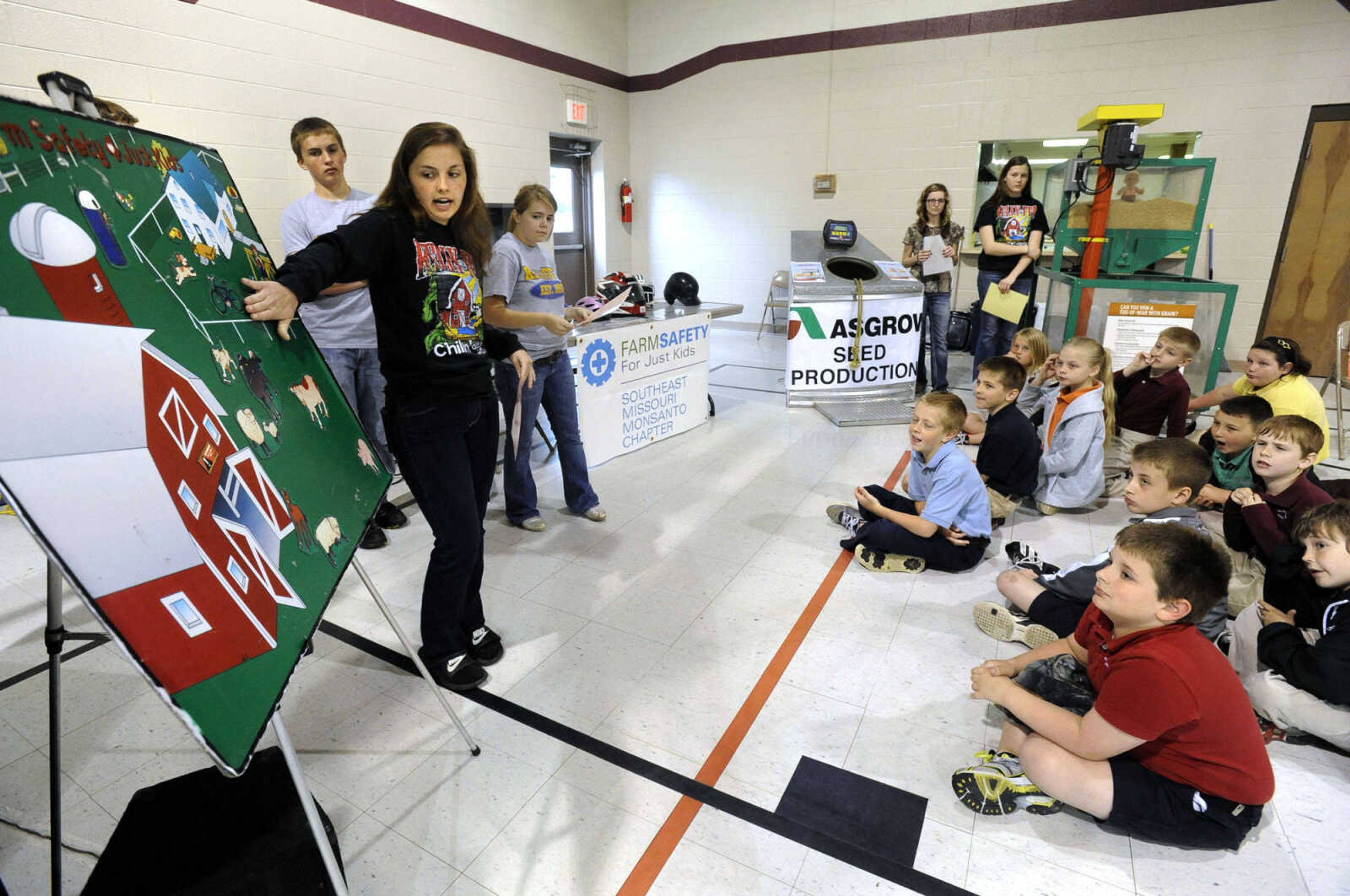 Kelly High School FFA member Rachel Birk discusses farm animal safety with third-grade students of St. Ambrose School in Chaffee at the Farm Day event.