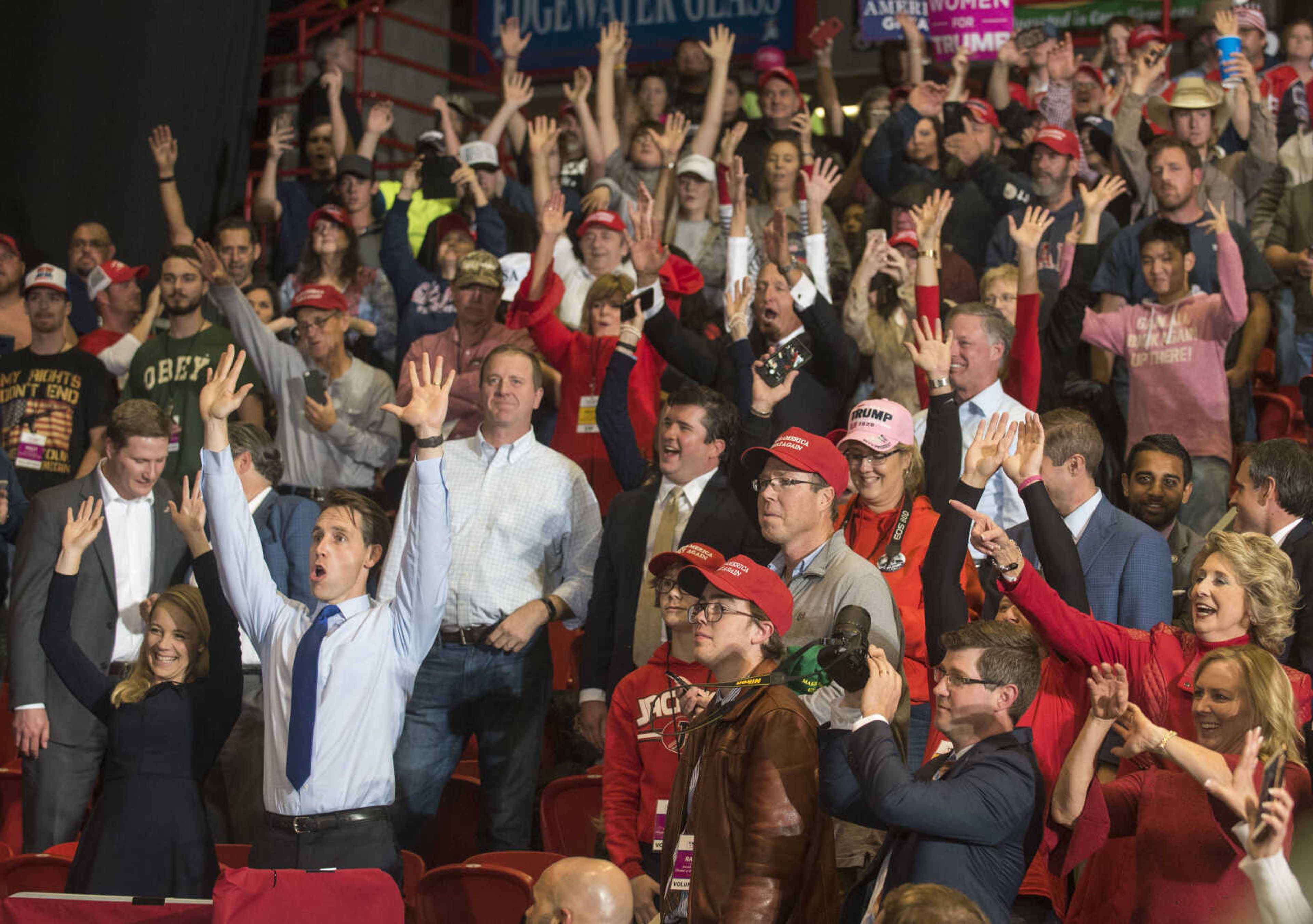 Missouri Attorney General and U.S. Senate candidate Josh Hawley, lower left, leads the crowd in the wave during a Make America Great Again rally Monday, Nov. 5, 2018, at the Show Me Center in Cape Girardeau.