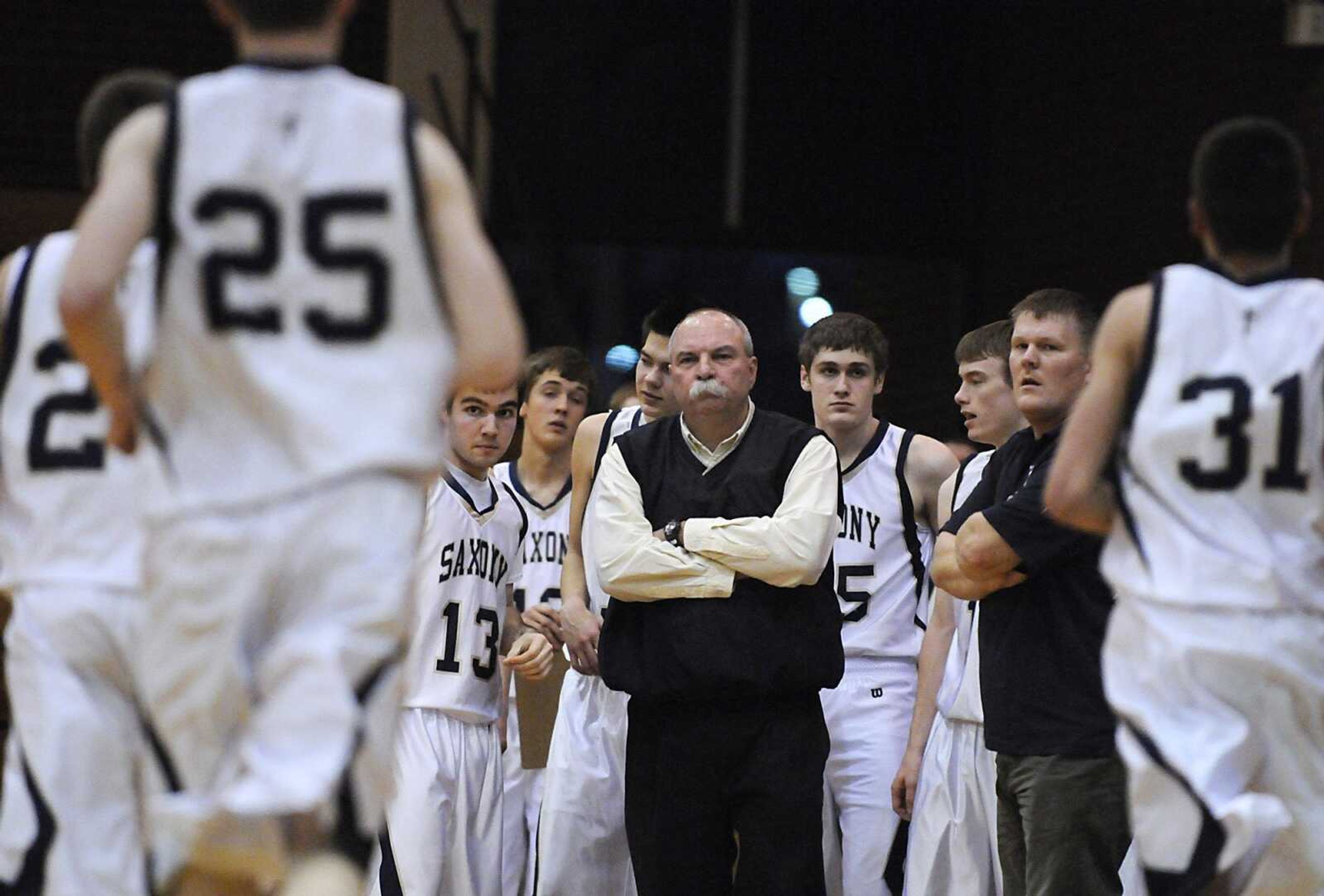 Saxony Lutheran coach Sam Sides waits for players to join him on the sidelines during a first-quarter timeout at the Class 3 sectional game Wednesday against Bayless at Jefferson College in Hillsboro, Mo. Bayless won 63-50. (Kristin Eberts)