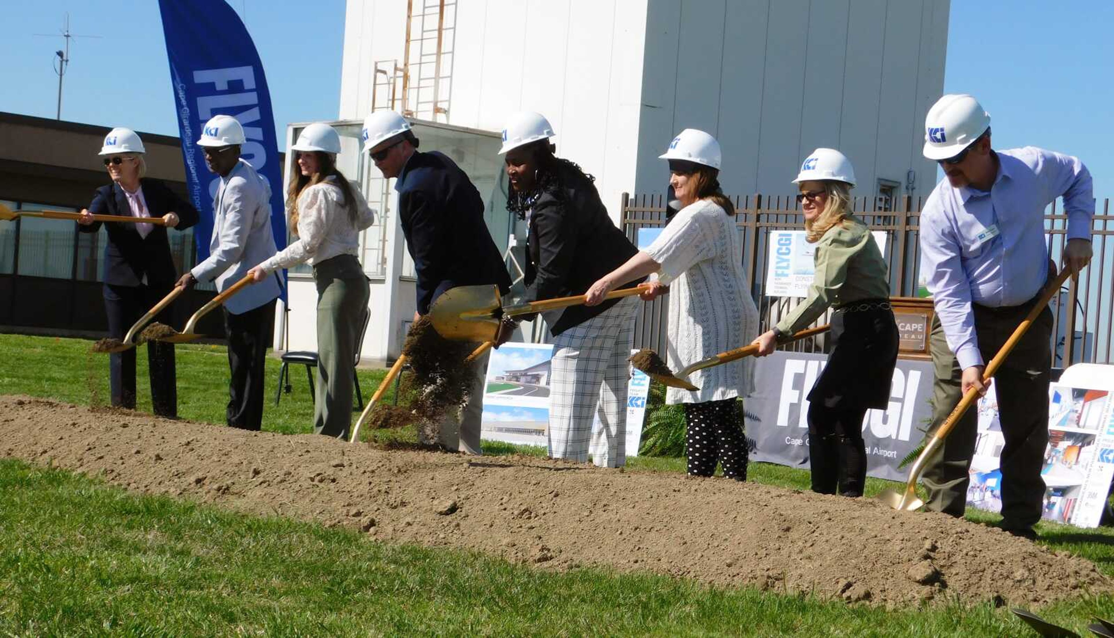 From left, Cape Girardeau Mayor Stacy Kinder; city manager Kenneth Haskin; Burns and McDonnell consultant Jodi Cooper; chairman of the Airport Advisory Board Richard Knote; airport manager Katrina Amos; city engineer Amy Ferris; Ireland Architects, Stephanie Ireland; and KCI Construction's Mike Coan  participate Tuesday, April 11, in the groundbreaking ceremony for the new terminal at Cape Girardeau Regional Airport.