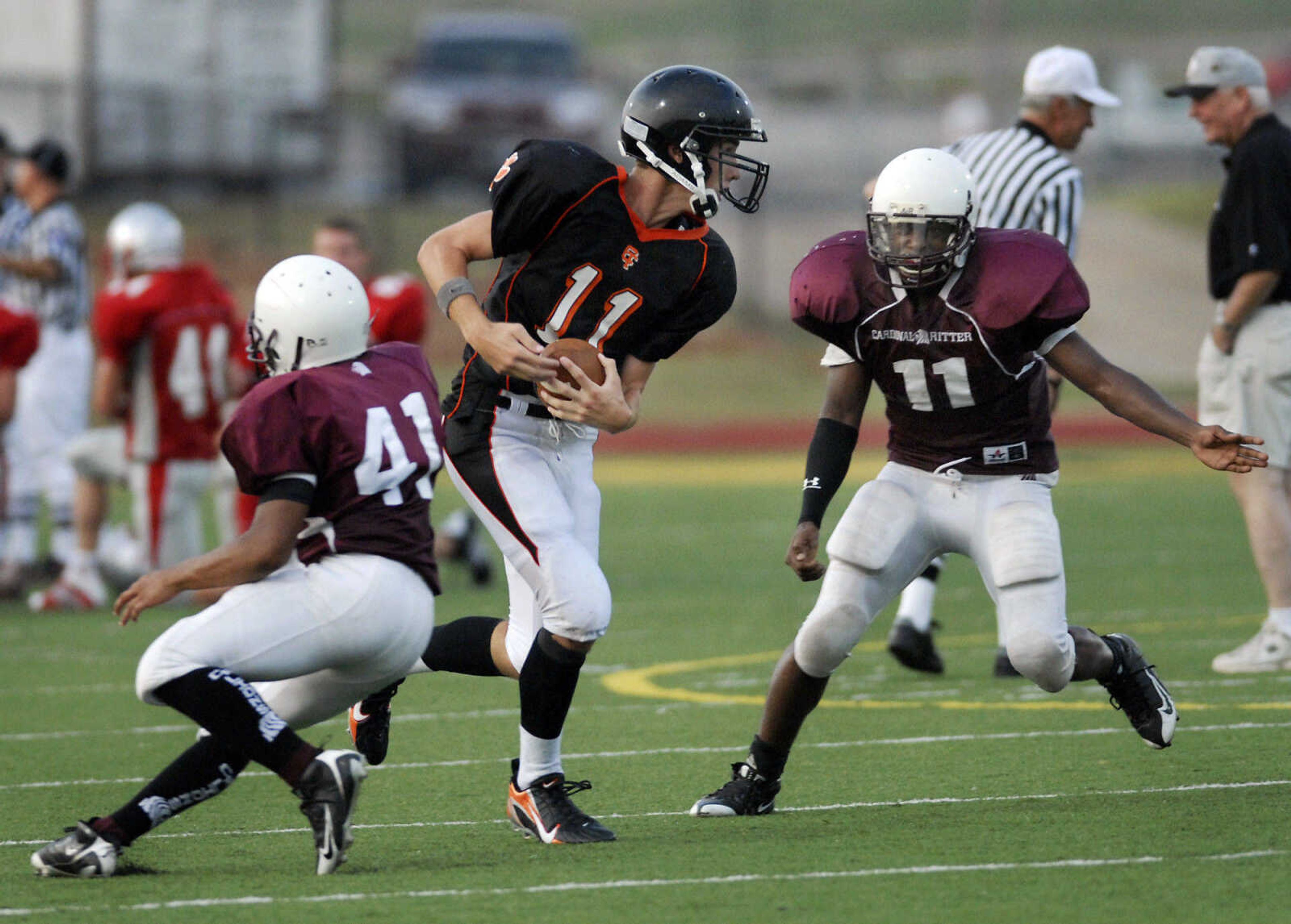 KRISTIN EBERTS ~ keberts@semissourian.com

Cape Central's Andrew Williams runs the ball past Cardinal Ritter  defenders during a jamboree game on Friday, August 20, 2010, at Farmington High School.