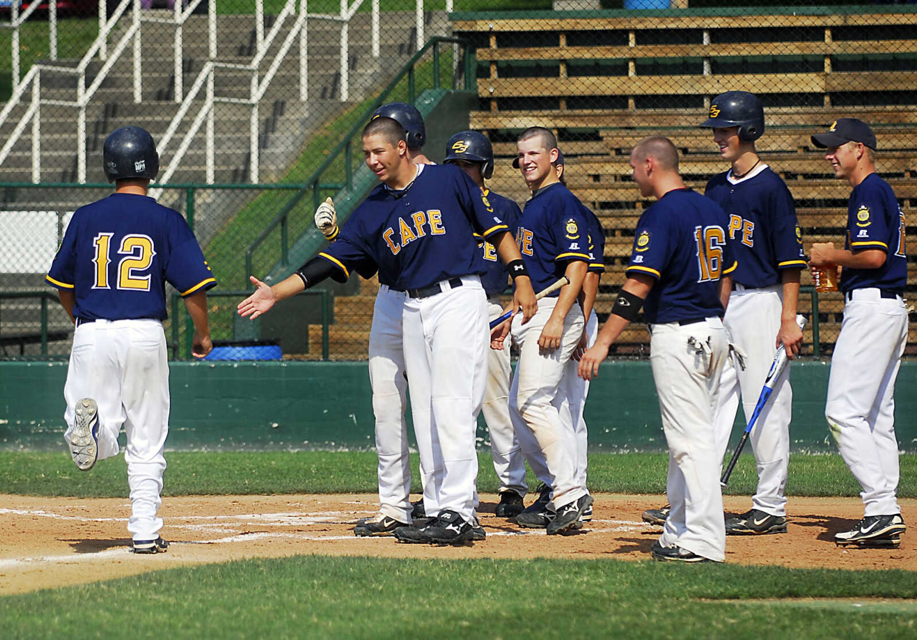 KIT DOYLE ~ kdoyle@semissourian.com
Cape Legion Post 63 team members congratulate Brady James at the plate following his second inning homer Monday, July 13, 2009, at Capaha Field.