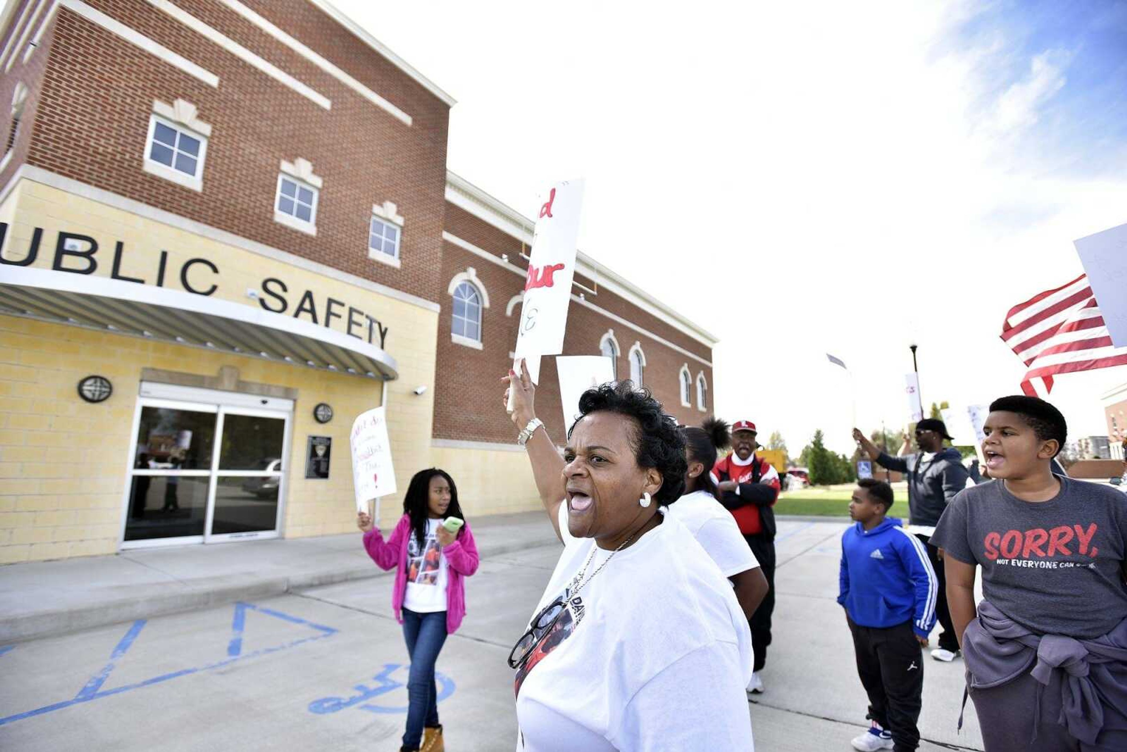 Betty Sharp chants along with fellow protestors outside the Sikeston Department of Public Safety on Saturday, Nov. 5, 2016 during the David Robinson Freedom March.