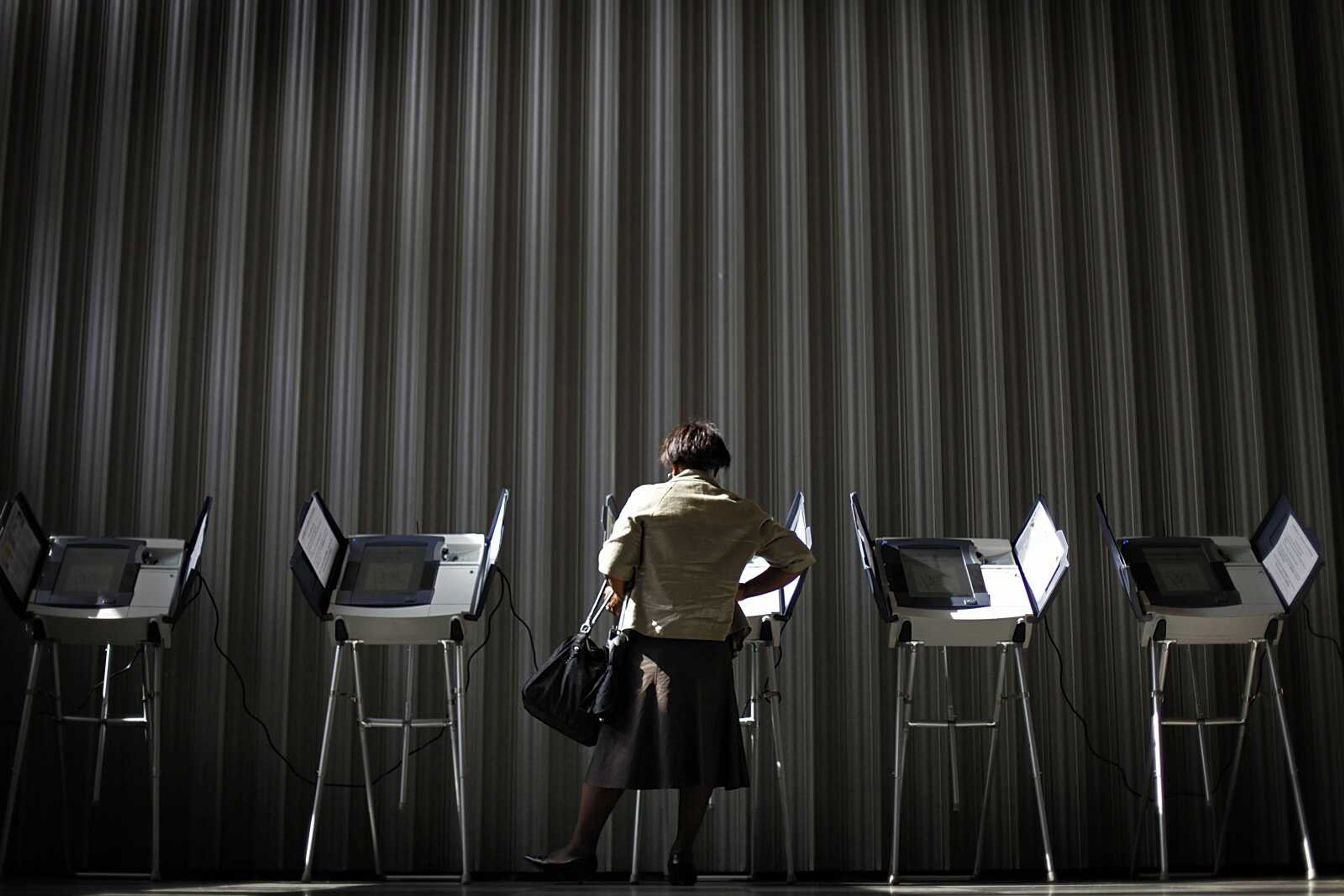 Georgi Chester, of College Park, Ga., casts her ballot during early voting Tuesday in Atlanta. (David Goldman ~ Associated Press)