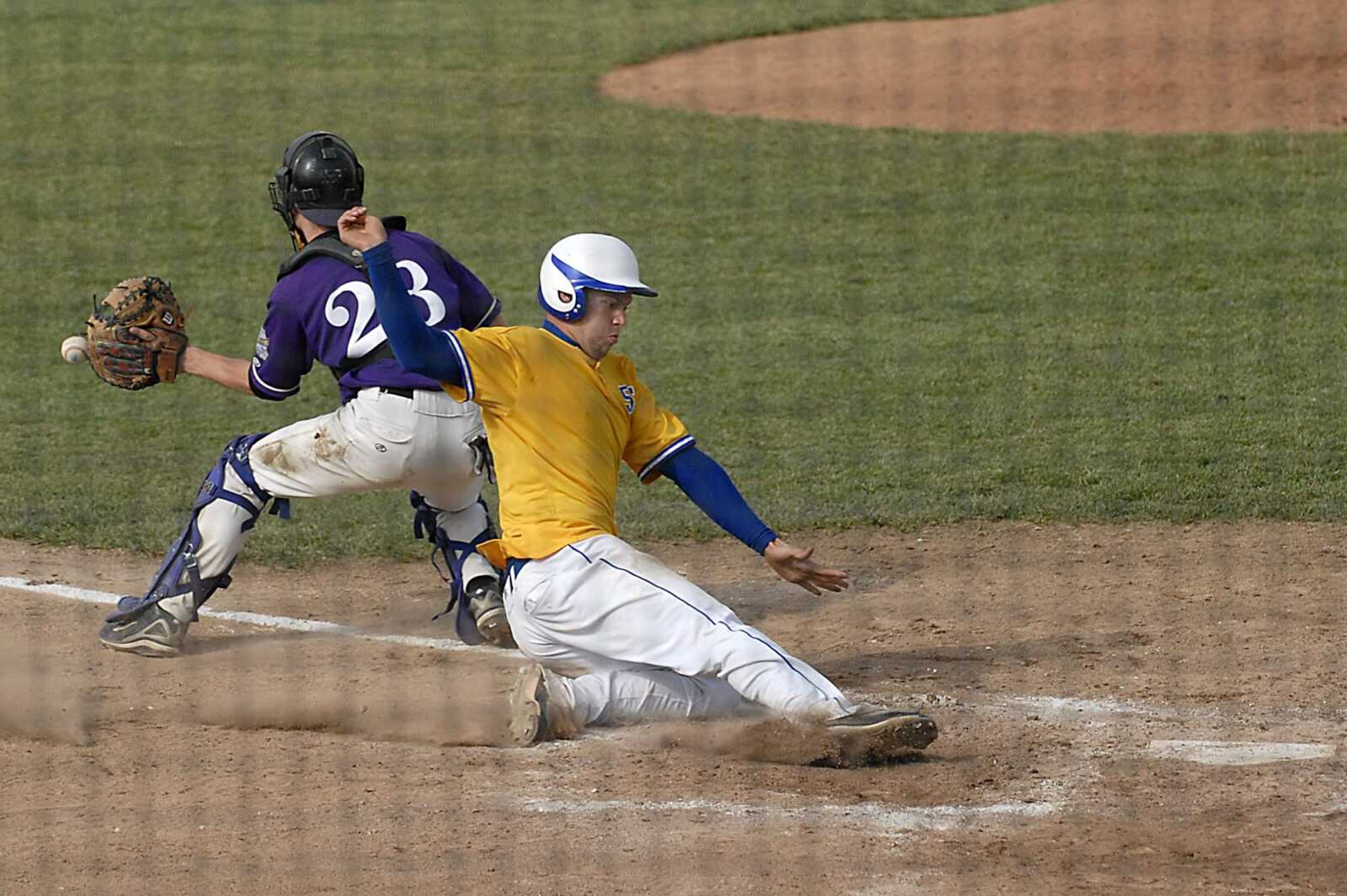 KIT DOYLE ~ kdoyle@semissourian.com
Scott City's Ryan Modglin scored as Hallsville catcher Tony McGee received the throw Wednesday, May 28, 2008, in the Class 2 Semifinal at Meador Park in Springfield.