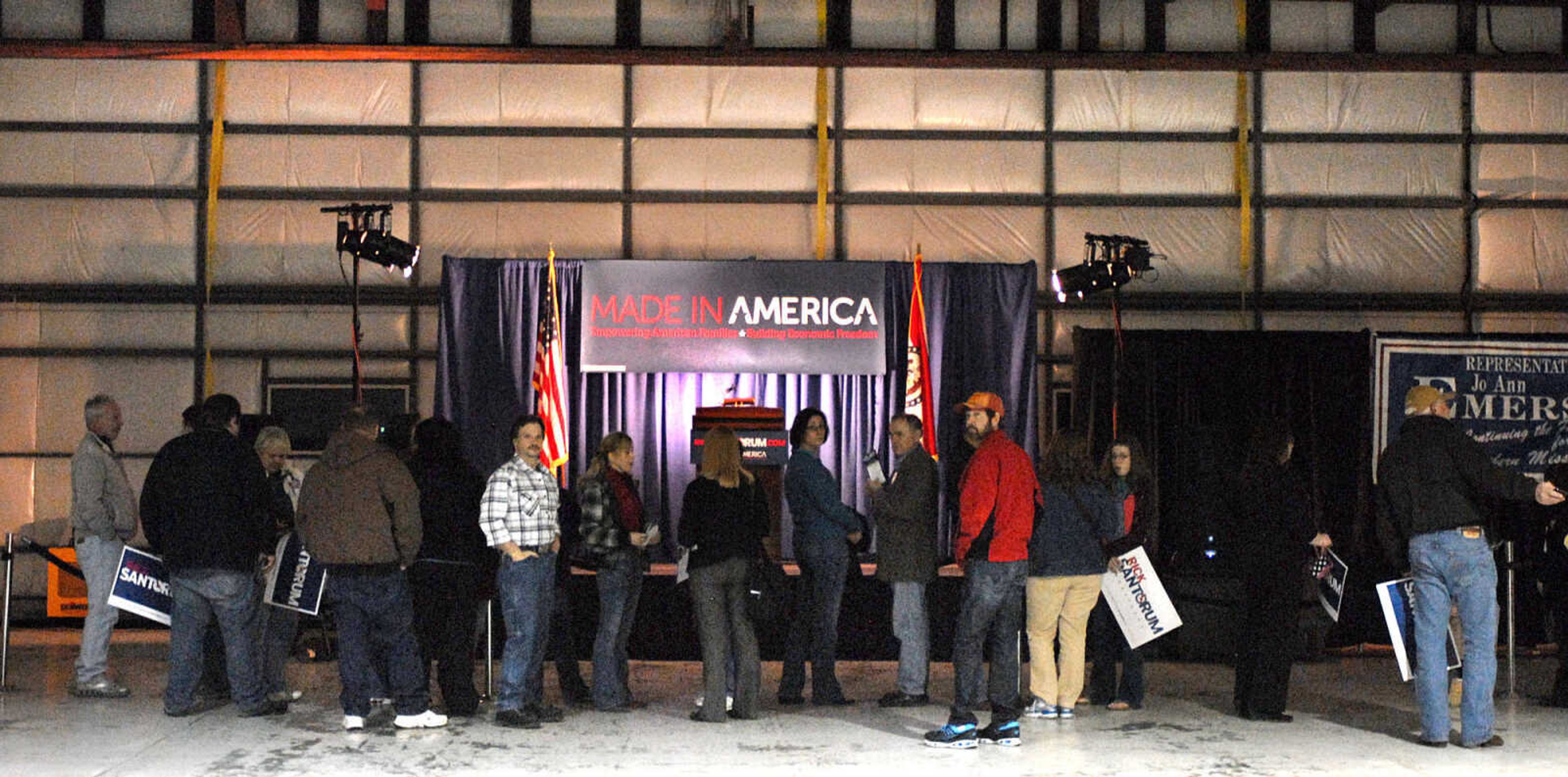 LAURA SIMON ~ lsimon@semissourian.com
Supporters of Republican presidential candidate Rick Santorum wait for his arrival Saturday night, March 10, 2012 during his campaign stop at the Cape Girardeau Regional Airport.