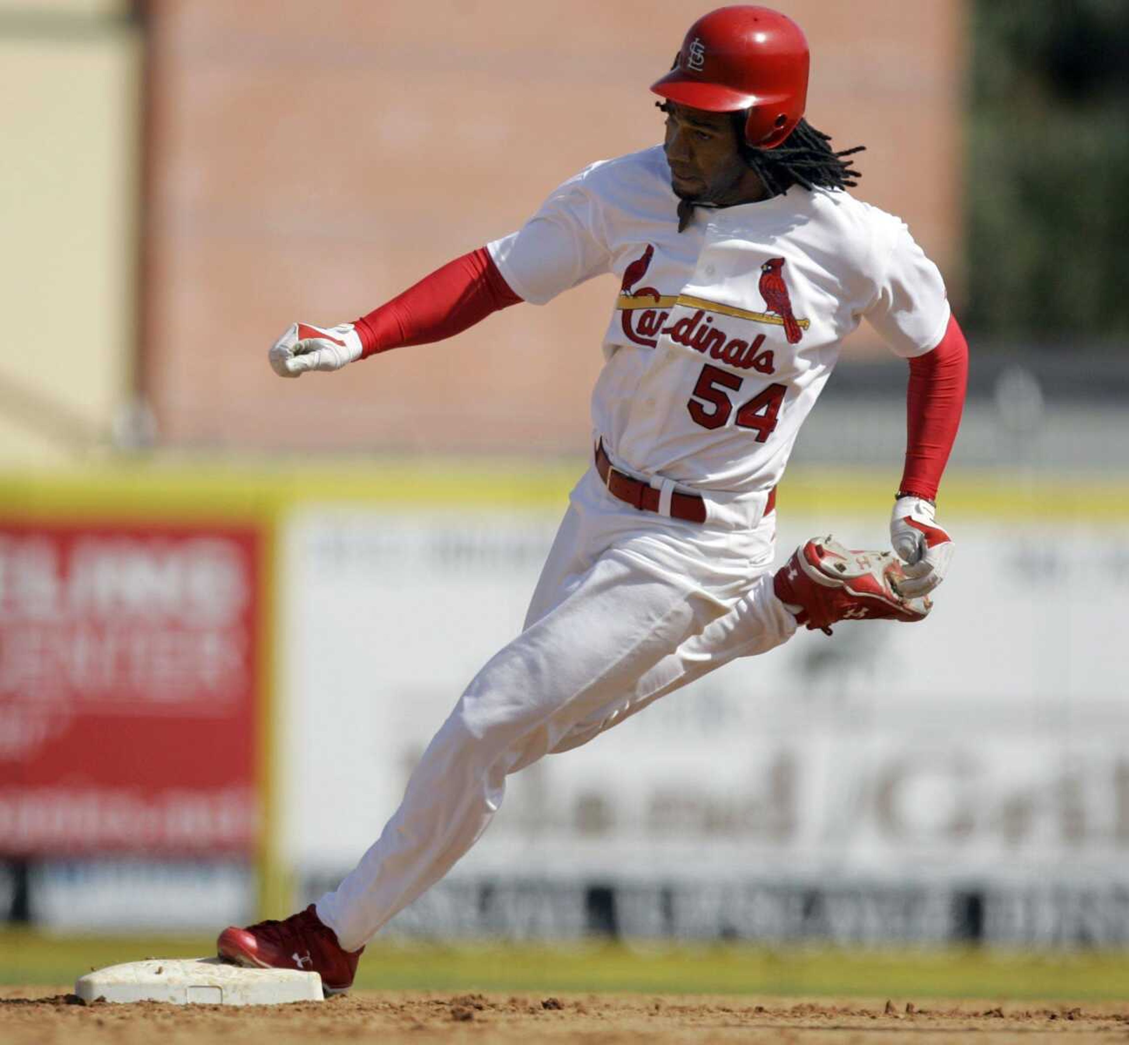 St. Louis Cardinals' Brian Barton rounds second and heads for third on a triple during the fifth inning of a spring training baseball game against the Tampa Bay Rays on Monday, March 2, 2009, in Jupiter, Fla. (AP Photo/Jeff Roberson)