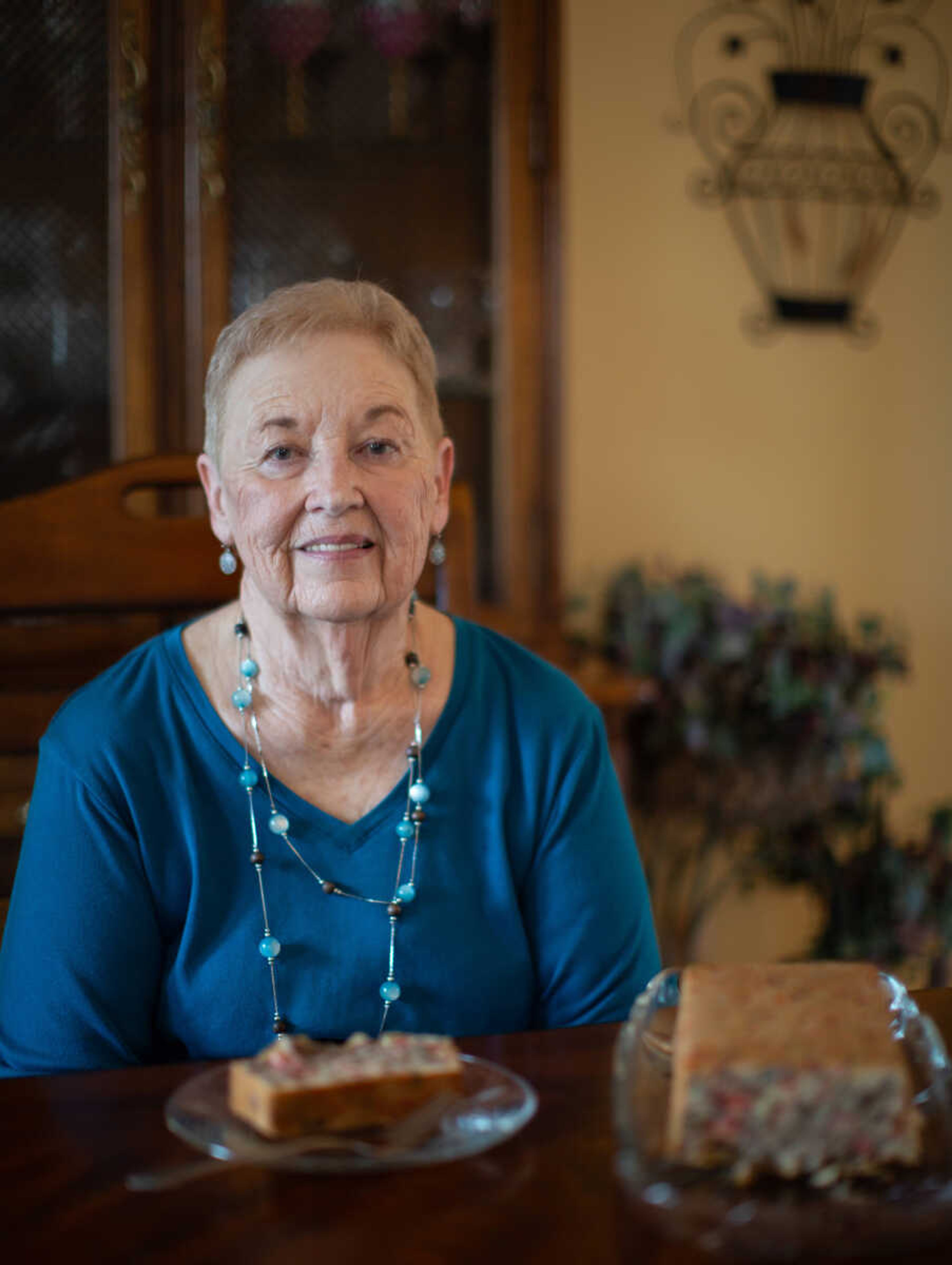 Sue Jones sits at her dining room table with a freshly-baked loaf of fruitcake. She usually serves fruitcake cold for Christmas, sometimes with whipped cream or icing on top. Jones has lived in the Jackson area her entire life.