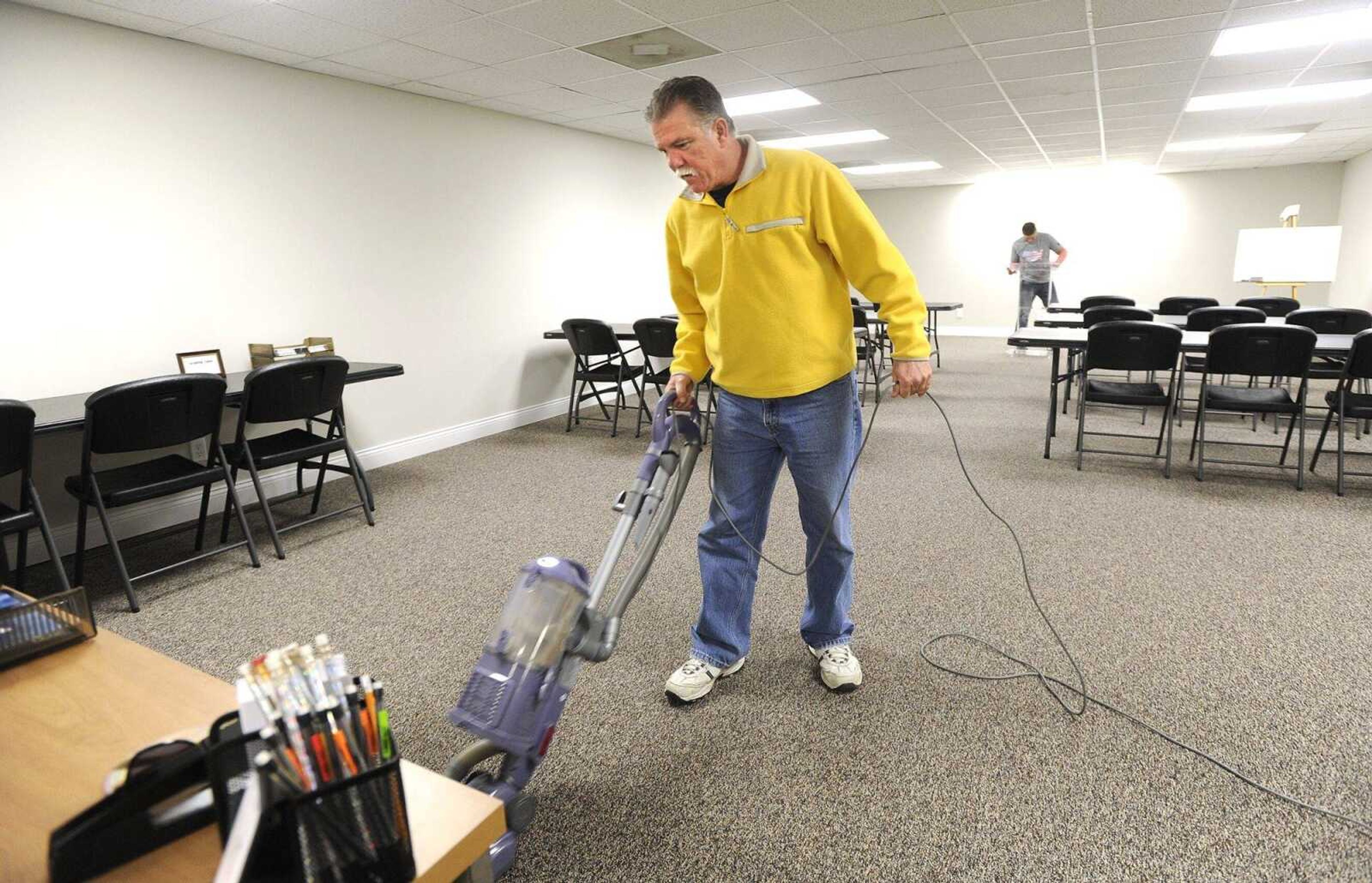 John McCollum vacuums the classroom Friday for the temporary Phase 1 facility of Adult and Teen Challenge of Mid-America at its campus north of Cape Girardeau.