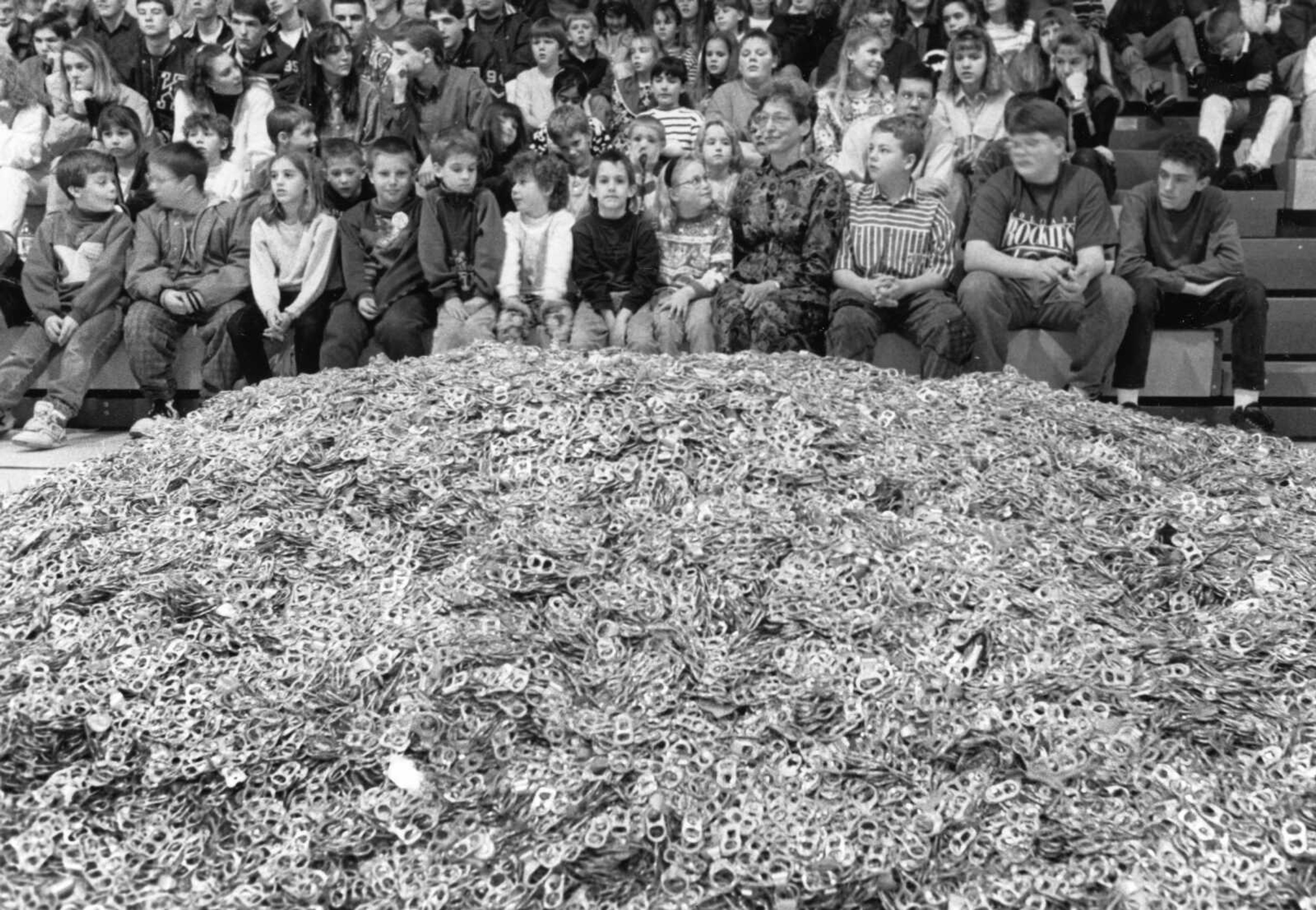 Published Feb. 4, 1993.
Students at the St. Denis Catholic School in Benton, Missouri, collected one million aluminum can pull tabs over a six-year period. The fifth- and sixth-grade classes of Marge King, seated in the front row, began collecting the tabs in 1988. The tabs weighed about 1,000 pounds and will be cashed in to buy an item for the school. (Don Shrubshell ~ Southeast Missourian archive)