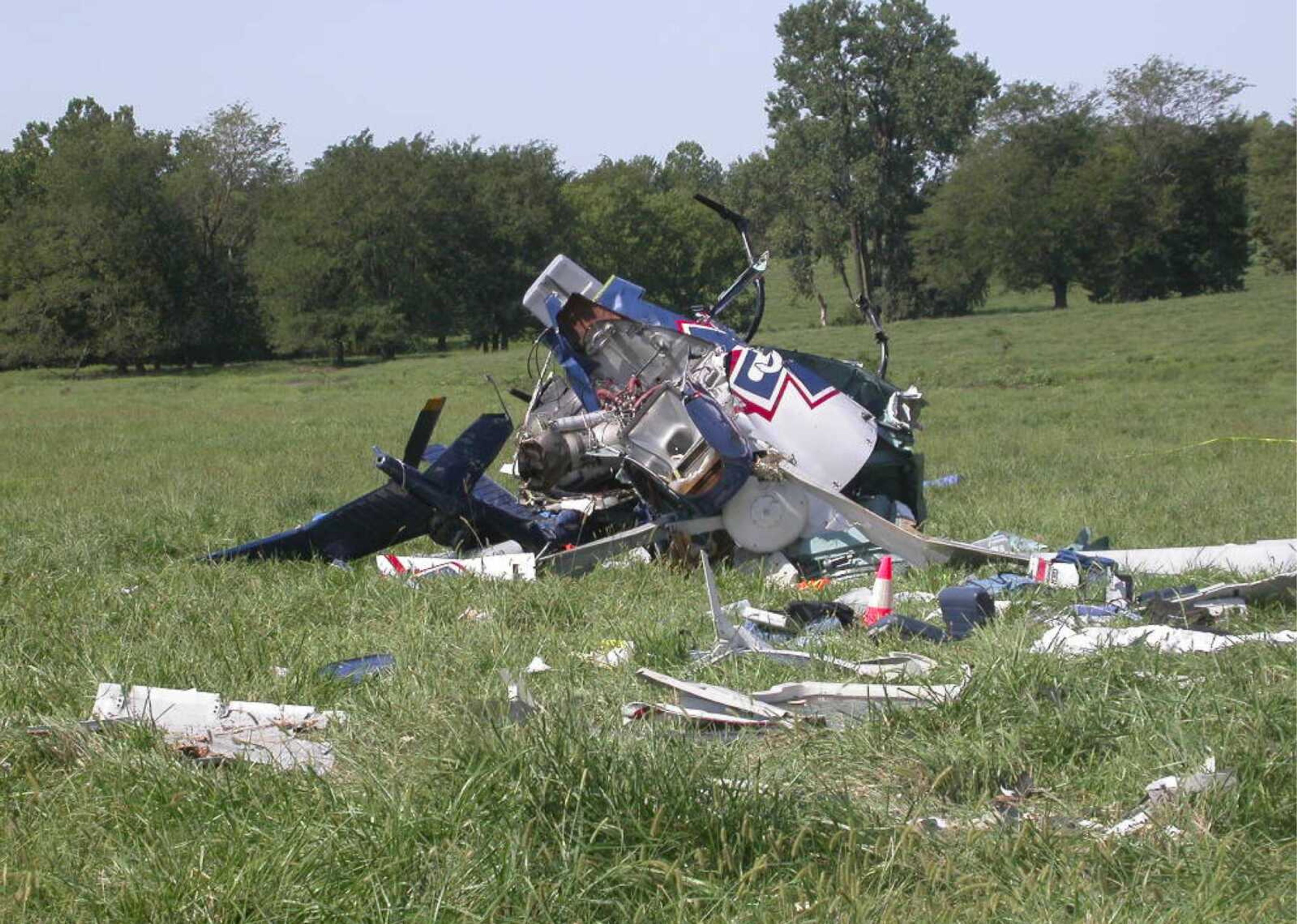 A photo provided by the National Transportation Safety Board shows the wreckage of an emergency medical helicopter that crashed in 2011 near Mosby, Mo. The pilot and three others were killed. The NTSB points to the distractions of cellphones and other devices in transportation accidents. (NTSB ~ Associated Press)