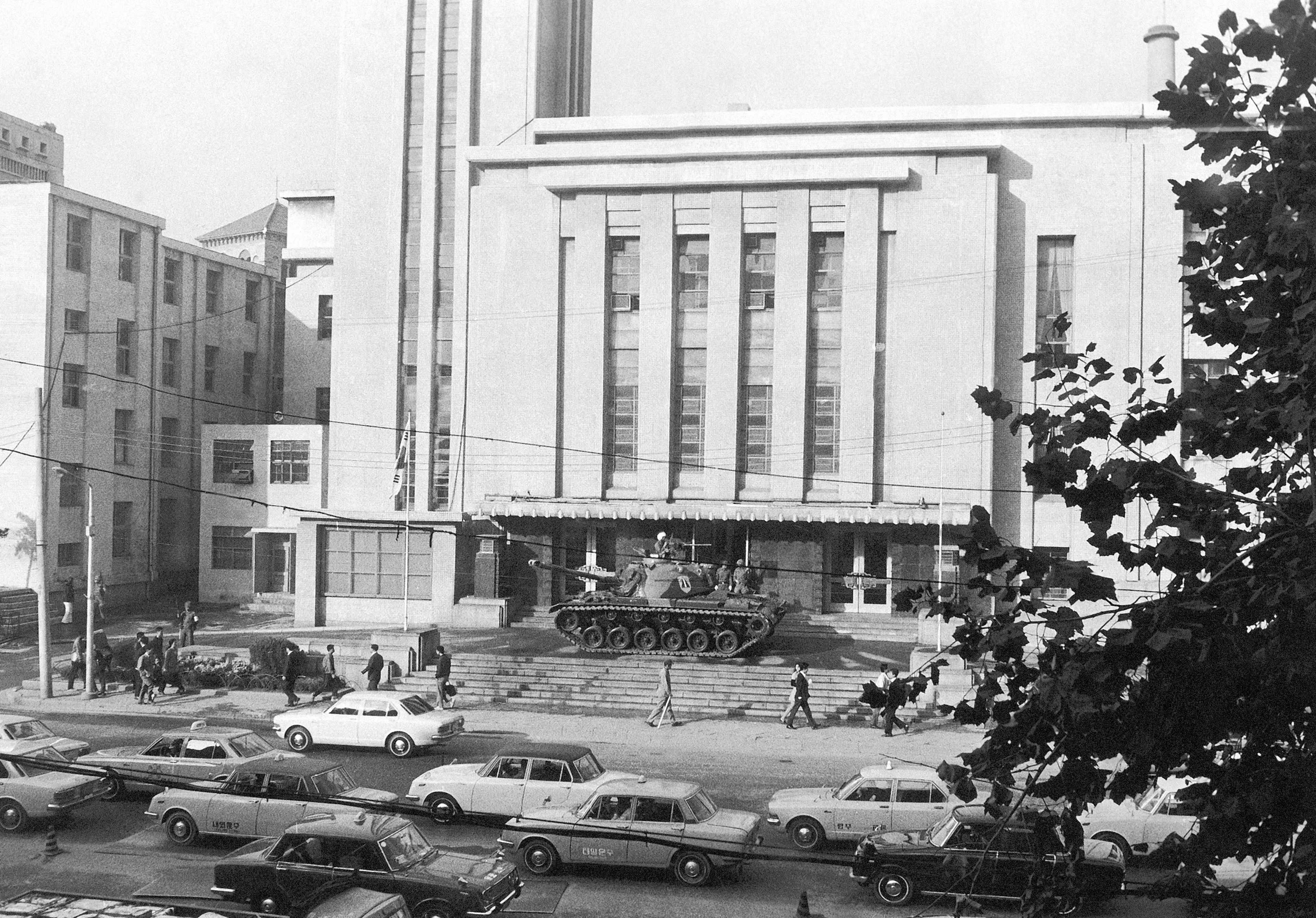 FILE- An army tank stands guard in front of the National Assembly building in the heart of this South Korean capital of Seoul on Oct. 18, 1972. The single-house parliament was closed by Martial Law proclaimed. (AP Photo/File)