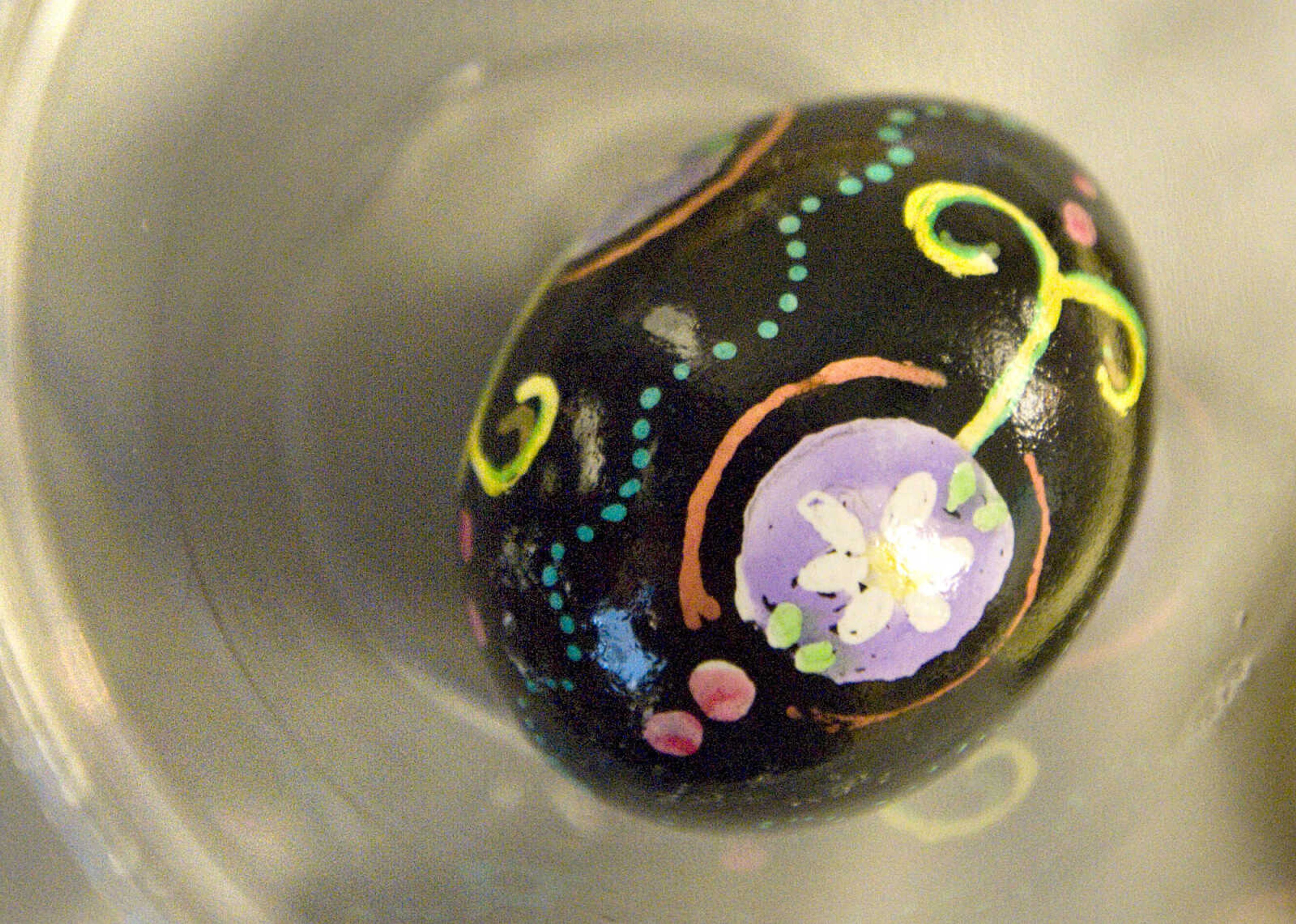 LAURA SIMON ~ lsimon@semissourian.com
A finished egg takes shelter in a cup Tuesday, March 19, 2013 during the Wonderful World of Pysanky workshop at Southeast Missouri State University's River Campus.