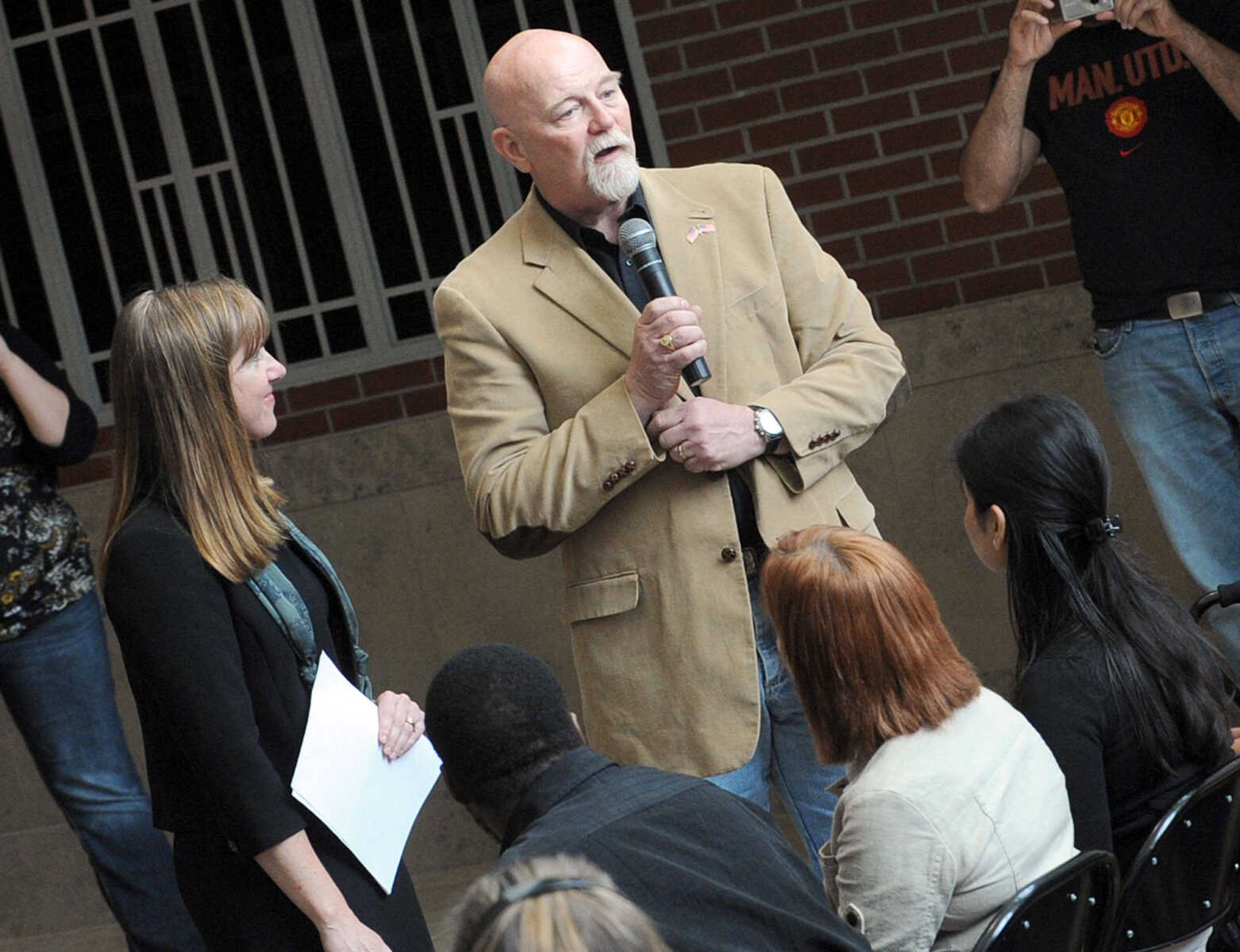 LAURA SIMON ~ lsimon@semissourian.com
Naturalization Examiner Abbie Crites-Leoni listens as Canada-born Herbert Clark Anderson introduces himself to the crowd Tuesday, May 1, 2012 during the naturalization ceremony inside the Rush Hudson Limbaugh, Sr. U.S. Courthouse in Cape Girardeau. Anderson was one of 17 petitioners for U.S. citizenship.