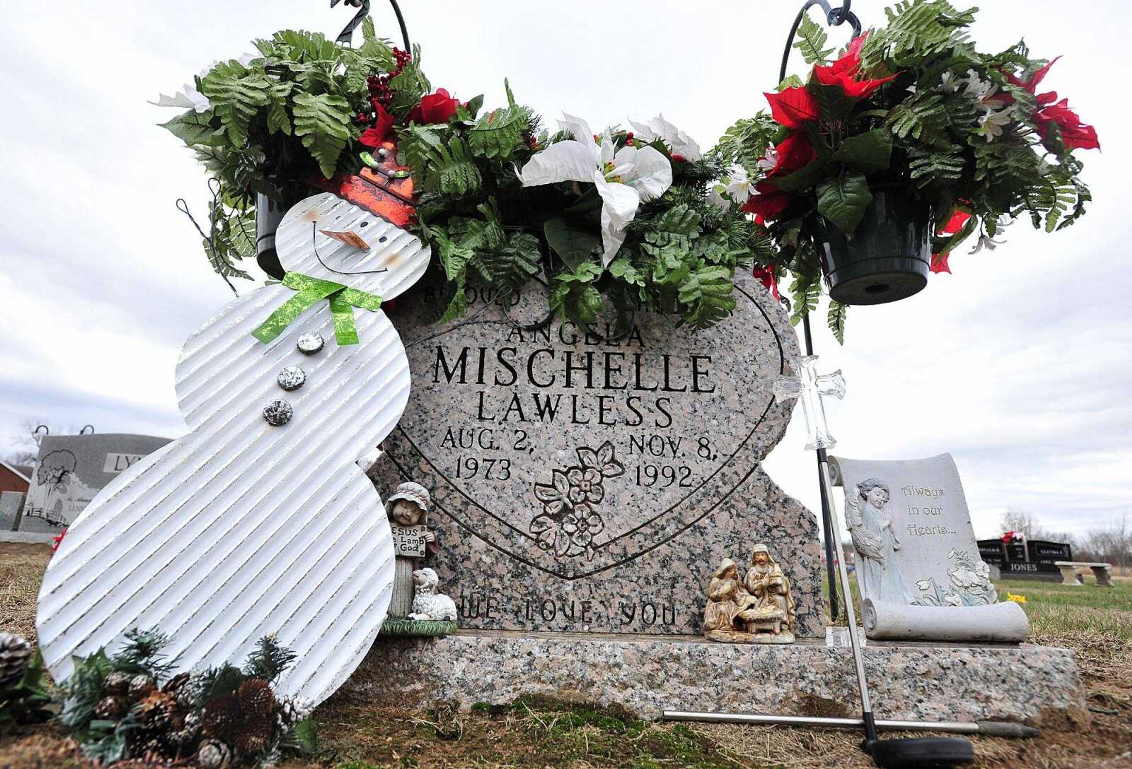 The gravesite of homicide victim Angela Mischelle Lawless is seen Dec. 28 at Unity Cemetery in Benton, Missouri.