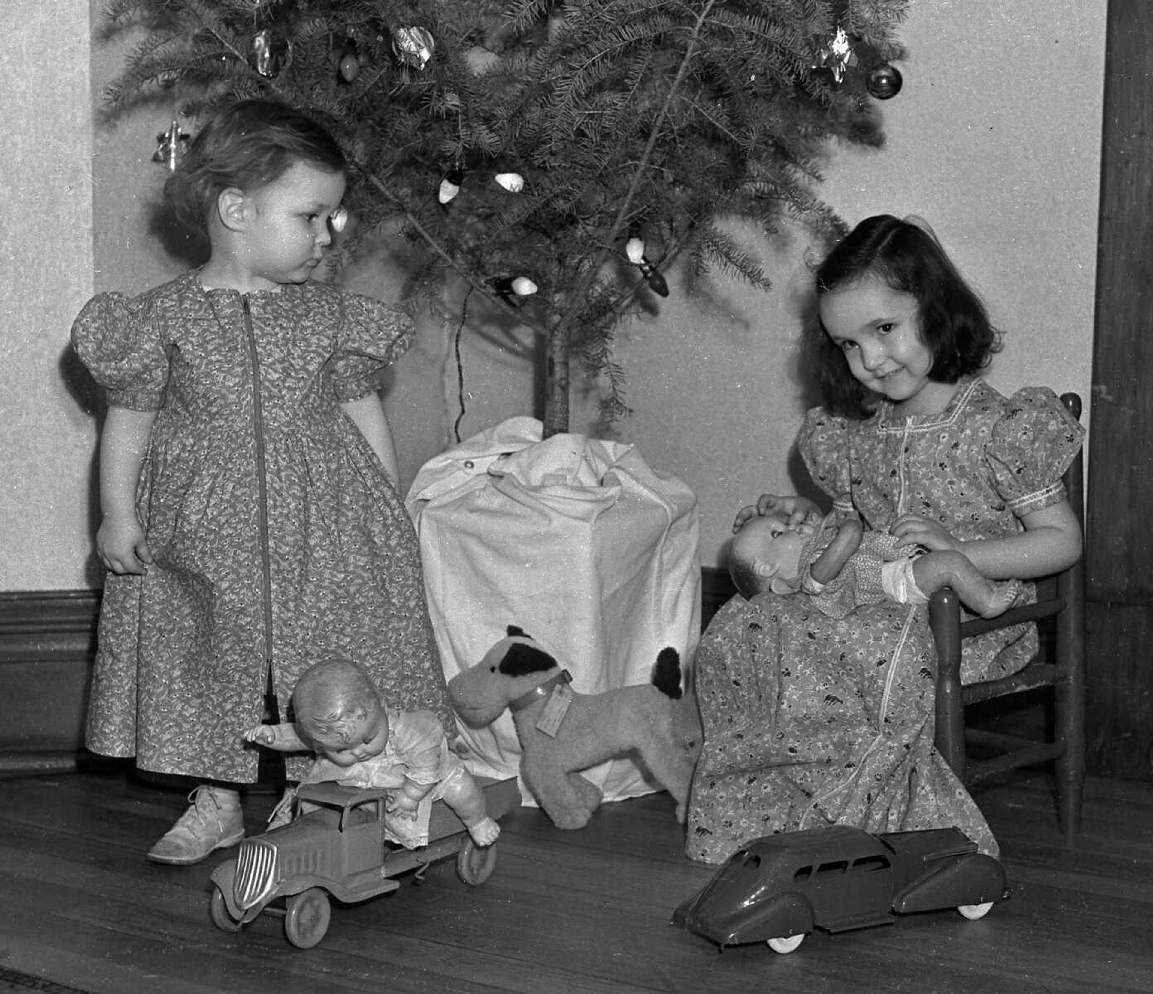 It looks as if these little girls received dolls for Christmas. (Missourian archive photo by G.D. Fronabarger)