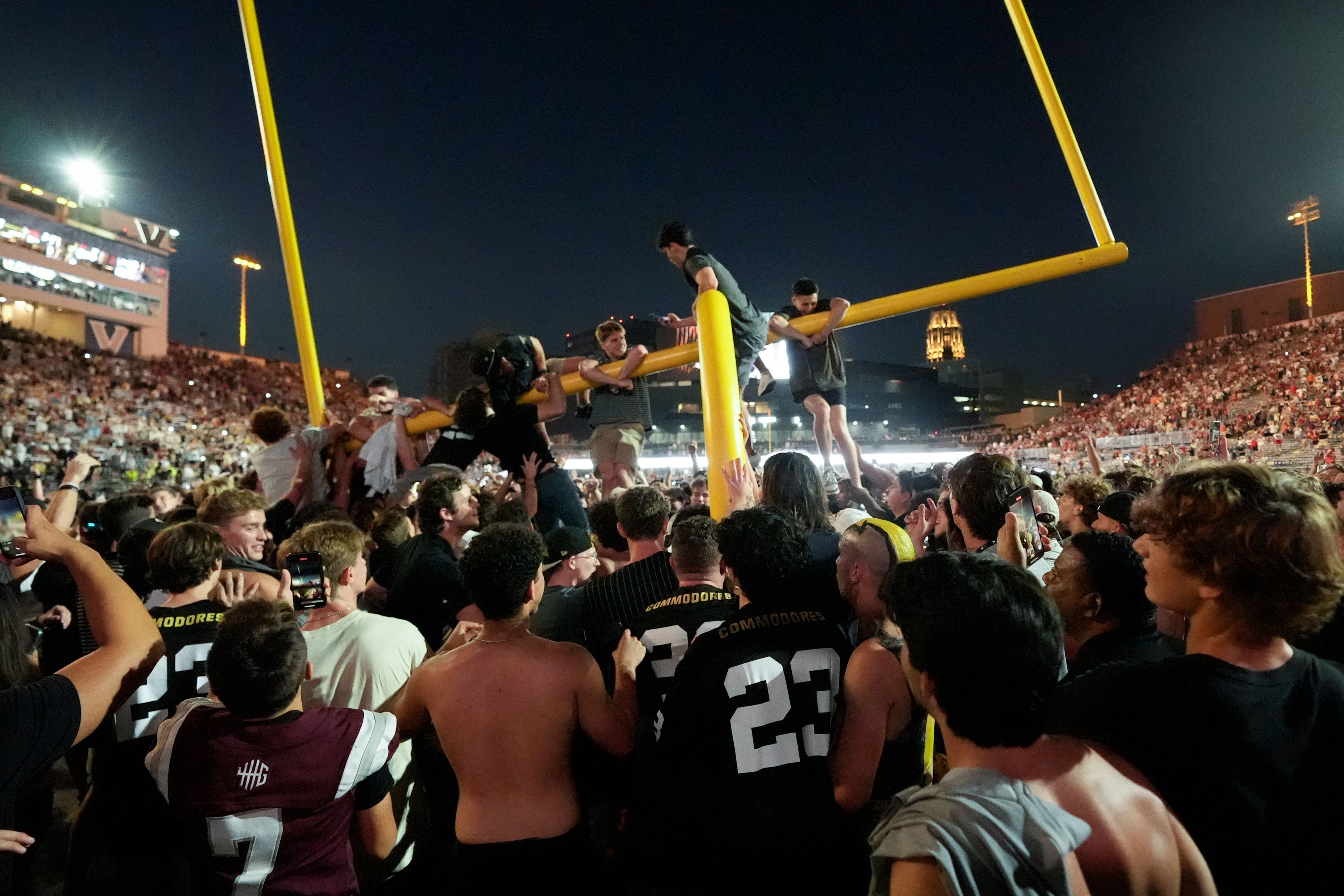 Vanderbilt fans tear down the goal post the after team's 40-35 win over No. 1 Alabama in an NCAA college football game Saturday, Oct. 5, 2024, in Nashville, Tenn. (AP Photo/George Walker IV)