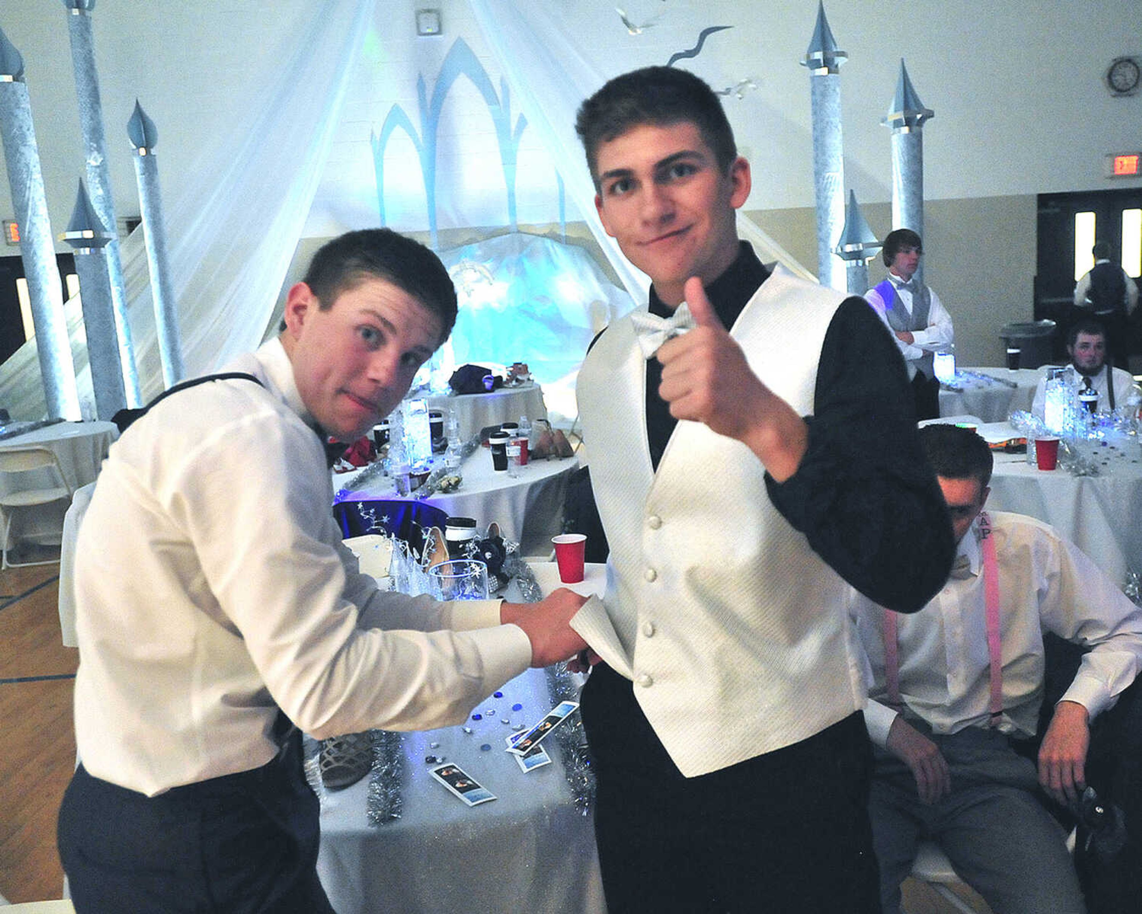 Oran students adjust their suspenders during prom Saturday, April 8 at Oran High School.